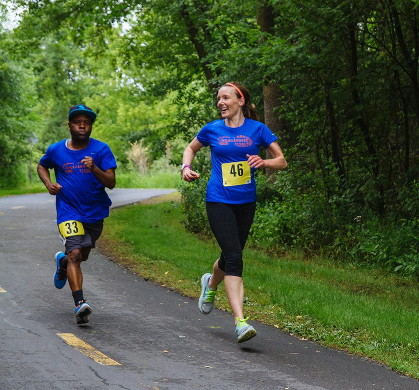 Mishka Vertin, right, of Mile in My Shoes nonprofit, ran with a resident at a local race.