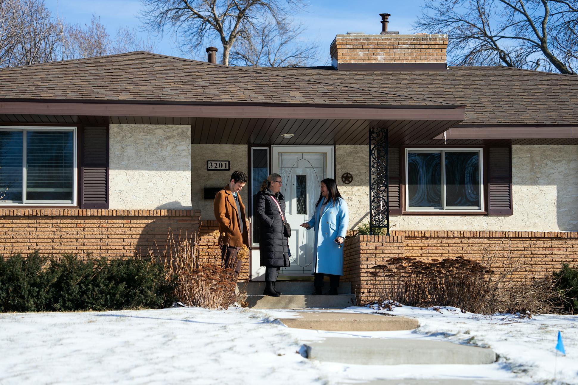 Libby Jacobson, right, and Kyle Staunton walked through their new house with real estate agent Kathy Borys in St. Anthony. “It has bigger lots and houses with more space,” Jacobson said.