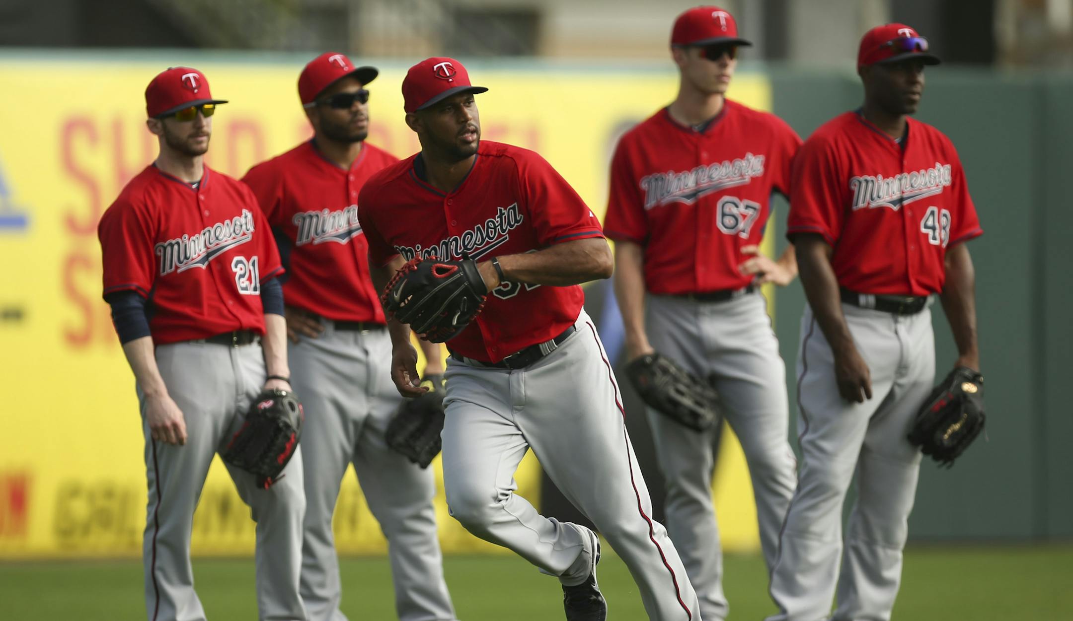 Minnesota Twins center fielder Aaron Hicks tracked a grounder during a drill for outfielders Saturday morning at Hammond Stadium. ] JEFF WHEELER &#xef; jeff.wheeler@startribune.com Finally, the entire Twins squad worked out at training camp on Saturday, February 28, 2015 in Fort Myers, FL.