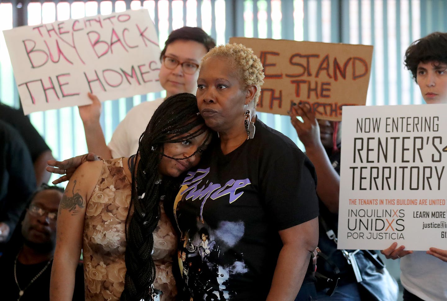 Following a meeting with Mayor Jacob Frey with tenants of landlord Mahmood Khan, Khan tenant Tecara Ayler, middle left, rested her head on the shoulder of fellow Khan tenant Patricia Grant during a press conference on the situation which calls for all tenants to be out by the end of August and seen at NorthPoint Health Wellness Center Friday June 1, 2018, in Minneapolis, MN.] DAVID JOLES &#x2022; david.joles@startribune.com Tenants in the more than 30 north Minneapolis homes owned by discredited