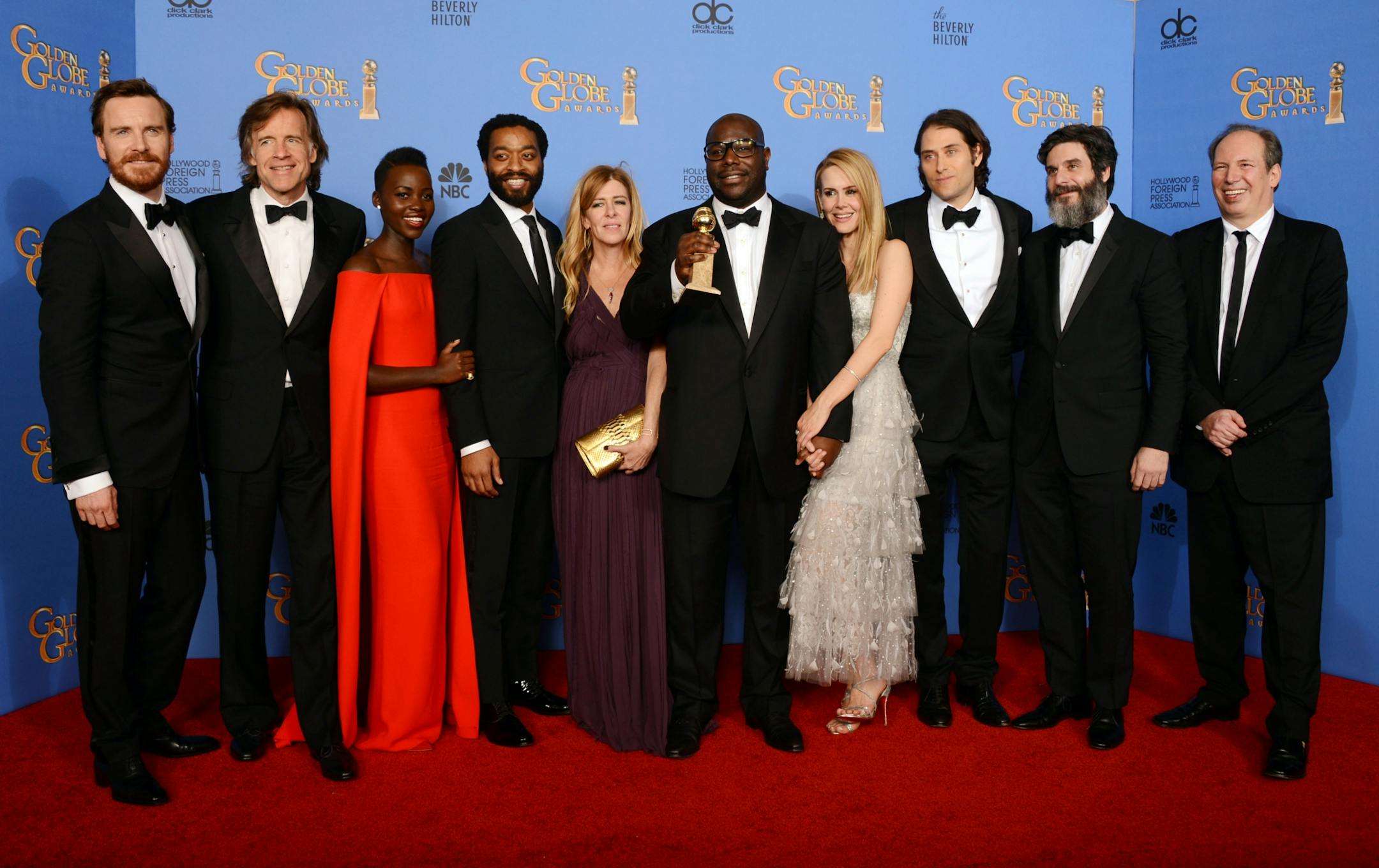 From left, Michael Fassbender, Bill Pohlad, Lupita Nyong'o, Chiwetel Ejiofor, Dede Gardner, Steve McQueen, Sarah Paulson, Jeremy Kleiner, Anthony Katagas and Hans Zimmer pose in the press room with the award for best motion picture - drama for "12 Years a Slave" at the 71st annual Golden Globe Awards at the Beverly Hilton Hotel on Sunday, Jan. 12, 2014, in Beverly Hills, Calif.