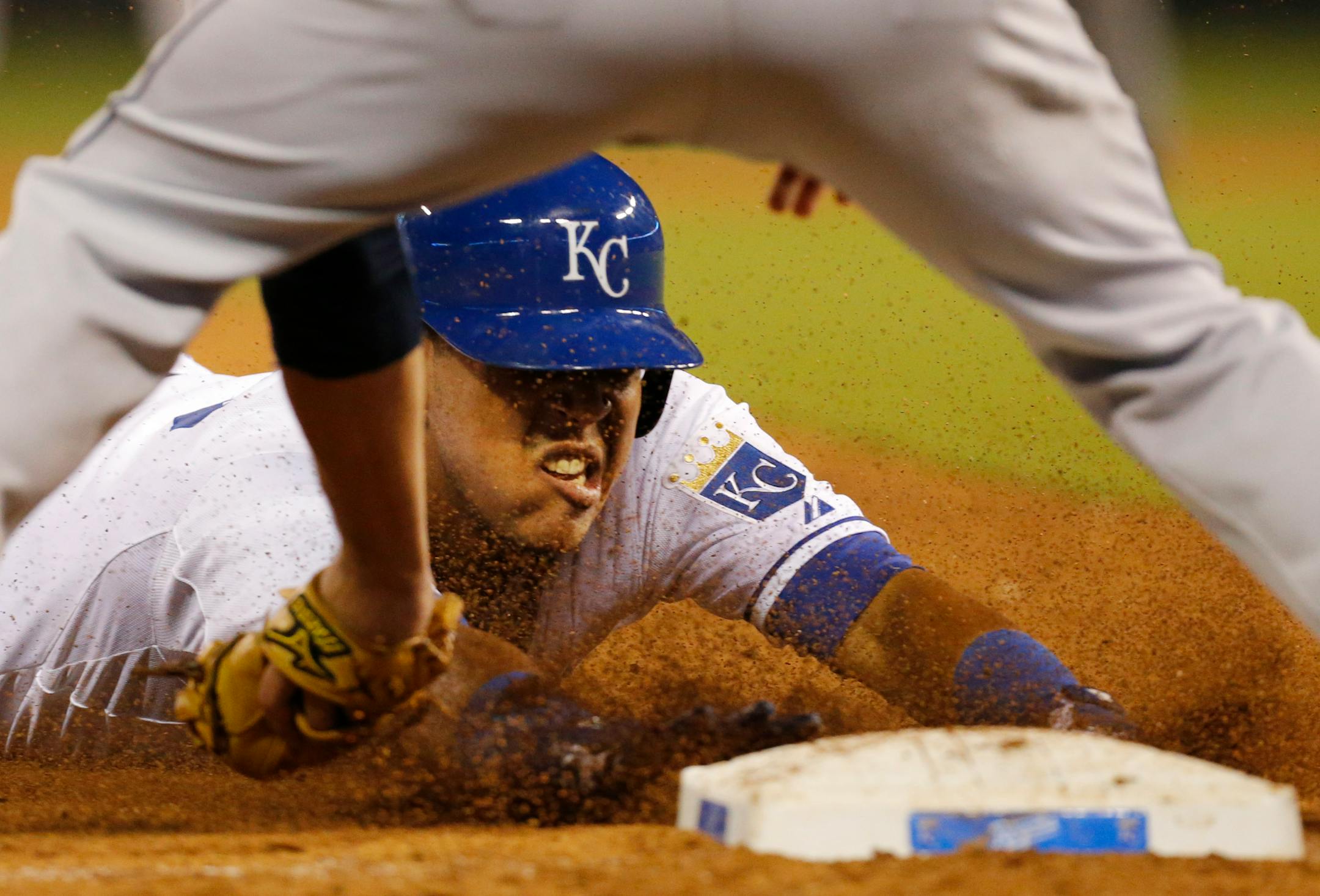 Kansas City's Salvador Perez beat the tag by Cleveland third baseman Lonnie Chisenhall during the sixth inning Monday night.= The Royals beat the Indians 7-1.