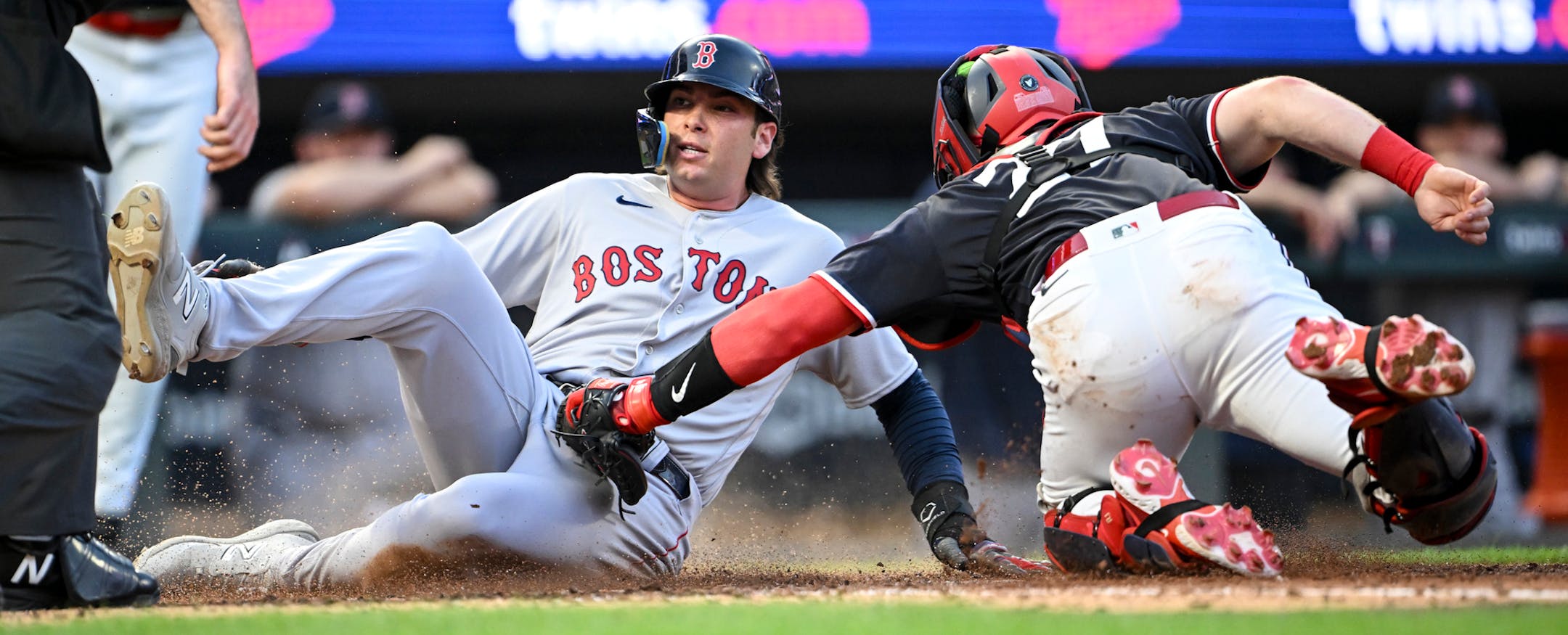 Boston Red Sox first baseman Triston Casas (36) slides home safely off a 3-run single hit by second baseman Christian Arroyo (39) as Minnesota Twins catcher Ryan Jeffers (27) late to the tag in the top of the 7th inning Tuesday, June 20, 2023, at Target Field in Minneapolis, Minn.