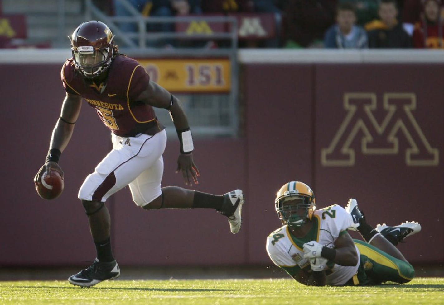 Gophers quarterback MarQueis Gray evaded NDSU's Bryan Shepherd but only managed to rush for 23 yards in the game.