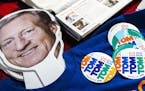 Stickers and a cardboard cutout of Democratic presidential candidate Tom Steyer sit on a table during a campaign event, Sunday, Dec. 8, 2019 at the Ja