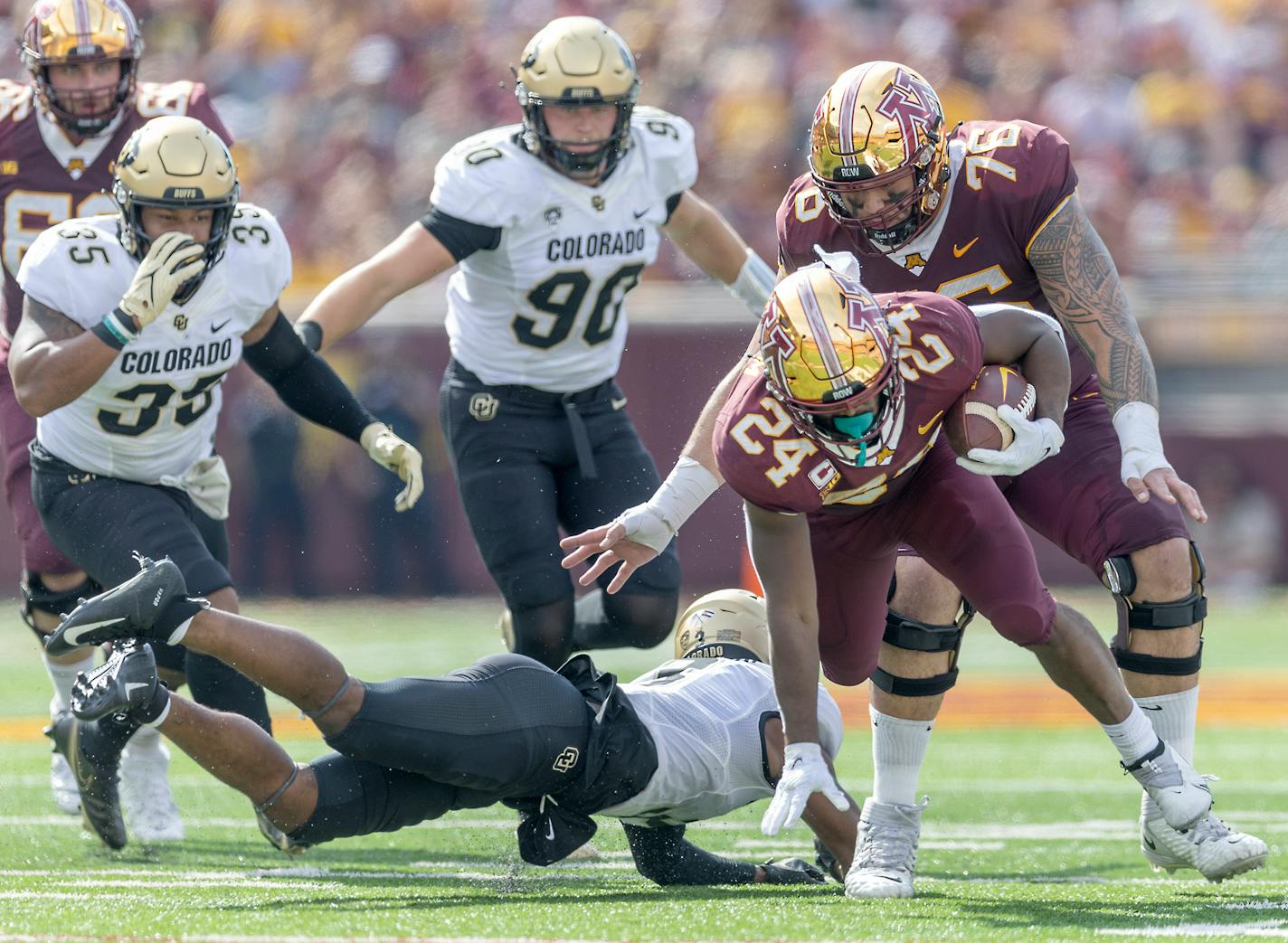 Minnesota's running back Mohamed Ibrahim (24) plows through the Colorado defense in the first quarter as they take on Colorado at Huntington Bank Stadium in Minneapolis, Minn., on Saturday, Sept. 17, 2022. ] Elizabeth Flores • liz.flores@startribune.com