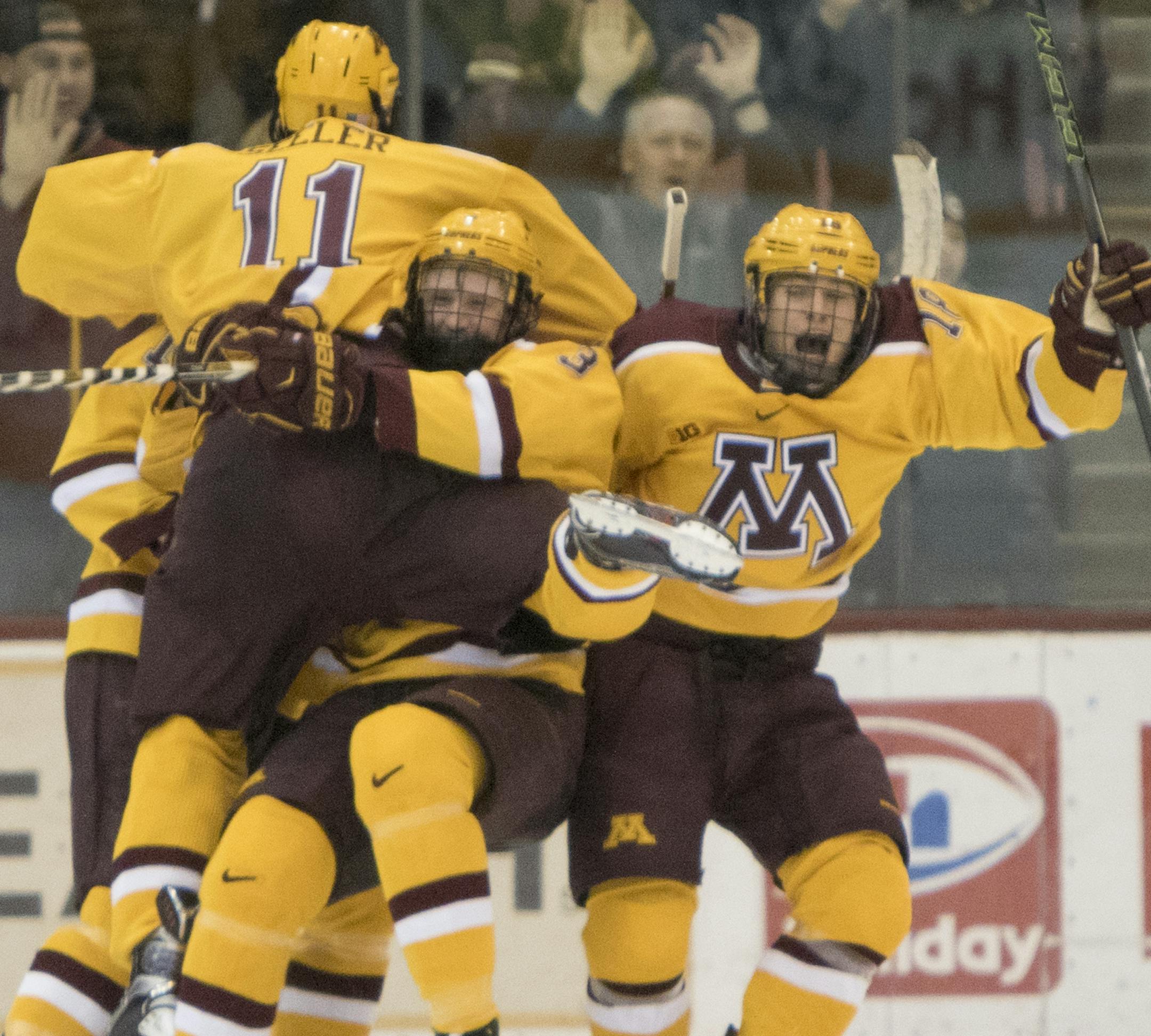Minnesota Golden Gophers forward Leon Bristedt (18), defenseman Jack Glover (3), forward Brent Gates Jr. (10), and defenseman Nick Seeler (11) are the first to meet and celebrate the game winning goal on the ice as the Minnesota Golden Gophers hosted the Ohio State Buckeyes in Big Ten Conference action on December 5, 2015. ] Special to Star Tribune MATT BLEWETT ï matt@mattebphoto.com - December 5, 2015, Minneapolis, MN, Big Ten Hockey, Minnesota Golden Gophers vs. Ohio State Buckeyes, 75332