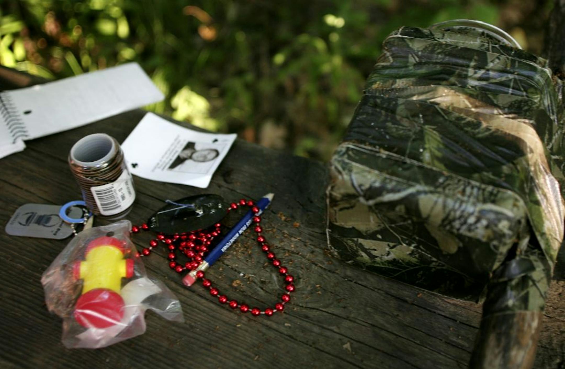 JENNIFER SIMONSON � jsimonson@startribune.com Eden Prairie, MN-July 31, 2007 Jeff and Lauren Weaver found a geocache they had hidden a few weeks earlier in order to add a coin to the collection of items in the cache. GENERAL INFORMATION: Geocaching with Eden Prairie residents Jeff and Lauren Weaver.