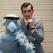 This image released by Disney shows the muppet character Sam the Eagle, left, with Ty Burrell in a scene from "Muppets Most Wanted." (AP Photo/Disney 
