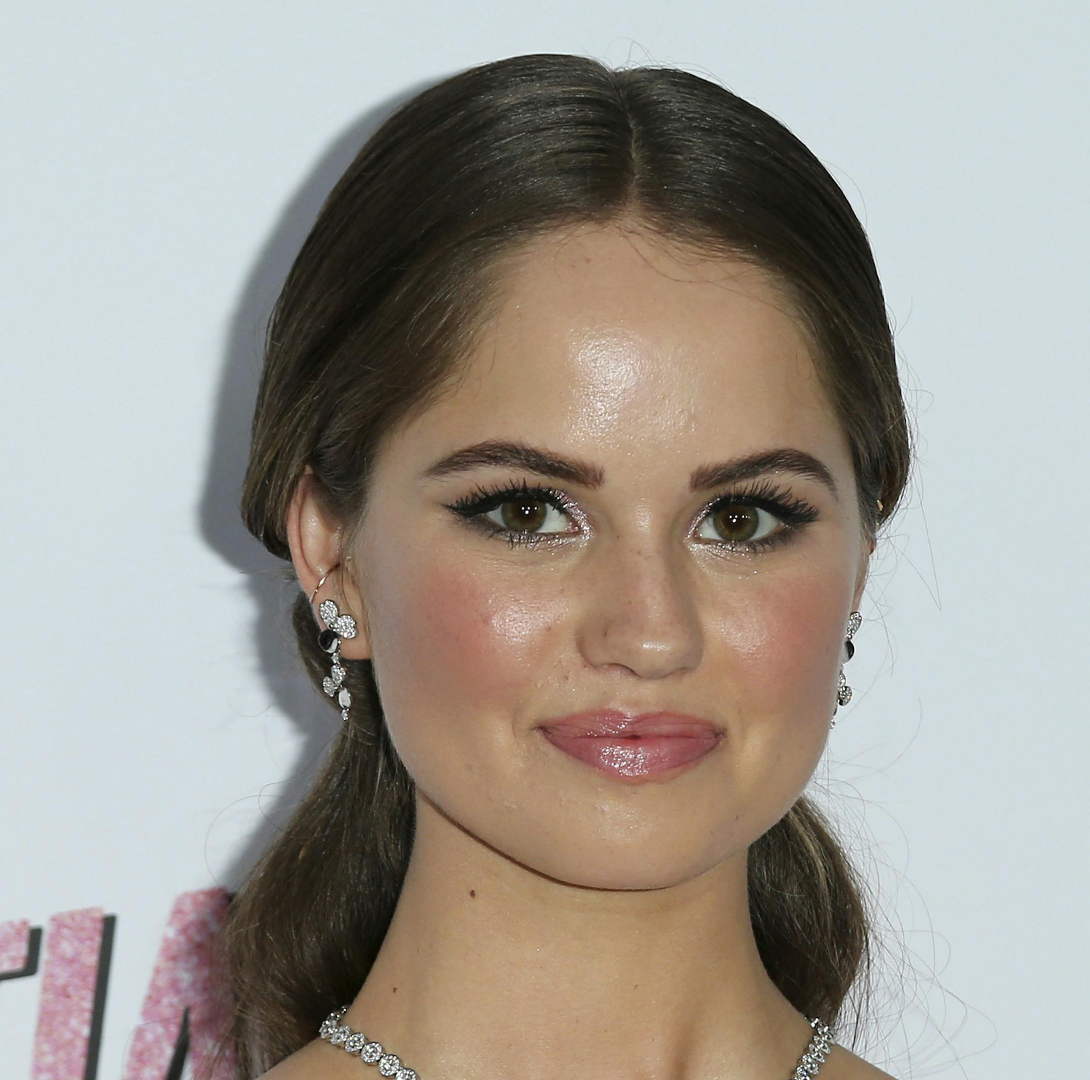 FILE - In this Aug. 9, 2018, file photo, Debby Ryan arrives at the LA Premiere of "Insatiable" at the Arclight Hollywood in Los Angeles. Both Ryan and Twenty One Pilots drummer Josh Dun announced their engagement on social media Saturday, Dec. 22. Th (Photo by Willy Sanjuan/Invision/AP, File)