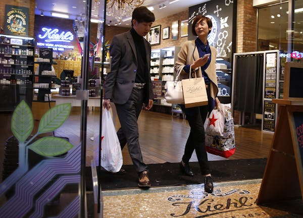 Lu Yan, right, of China chats with travel agent and guide Ming Jia of CIAC Travel while shopping at Mall of America in Bloomington. ] LEILA NAVIDI lei