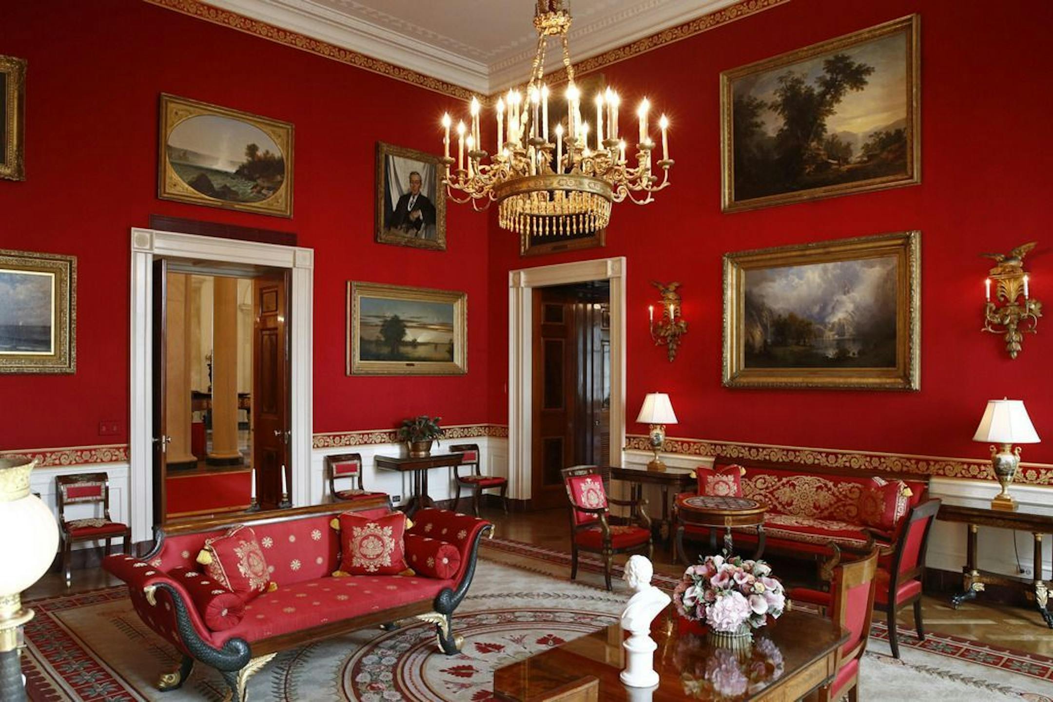 This Sept. 17, 2019, photo shows refreshed wall fabric in the Red Room of the White House in Washington. Sunlight streaming into the Red Room had left wall fabric "so faded it was almost pink," said Stewart McLaurin, president of the White House Historical Association.