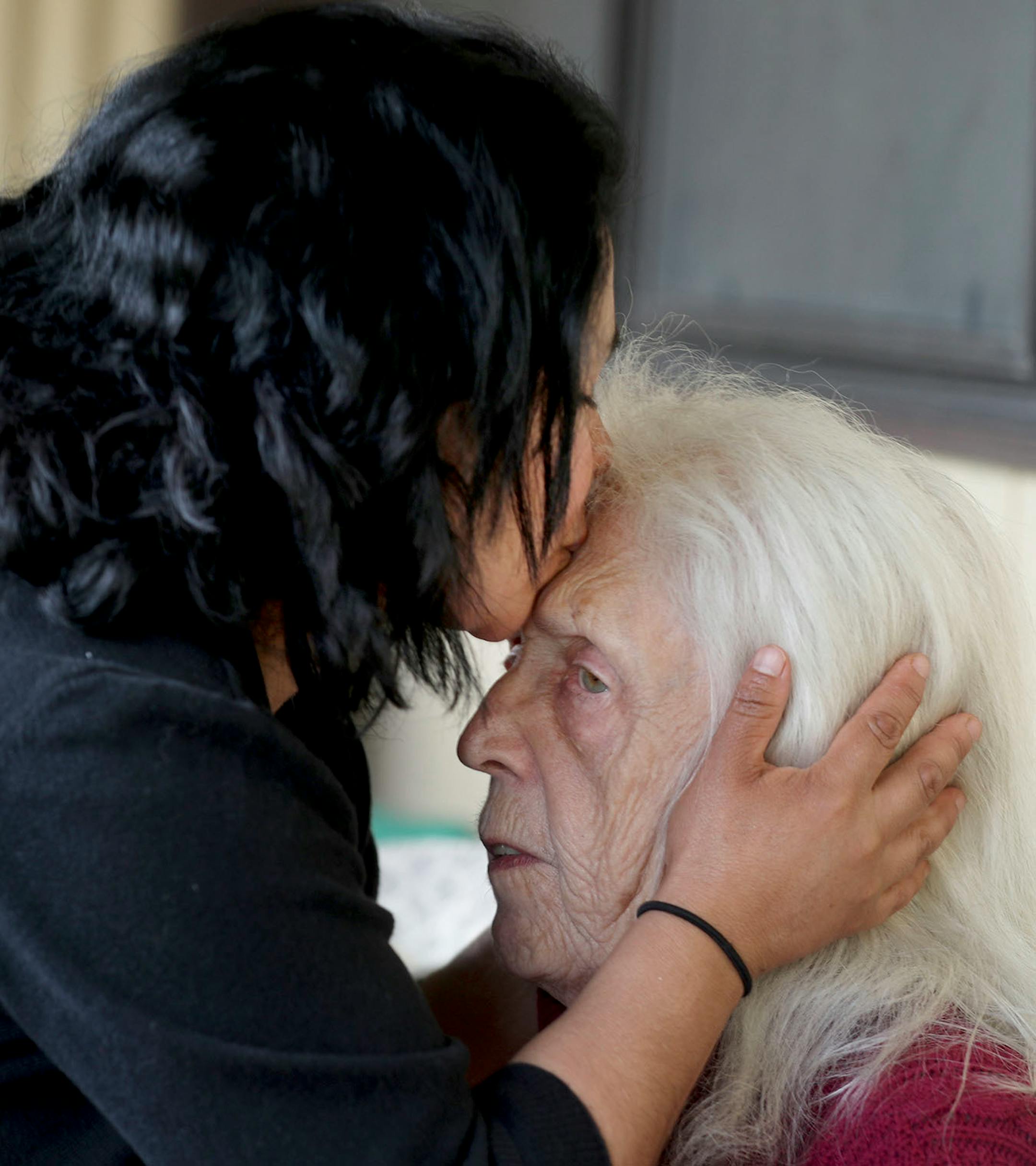 Antonia Alvarez, Lowry Grove mobile home park organizer and resident, kisses resident Jean Christianson, 81, in the final hours of their residence in the park Friday, June 30, 2017, in St. Anthony, MN. Lowry Grove closed it's gate and all residents had to be gone by 12 midnight the following day, the space slated to be redeveloped into multiple-family housing.