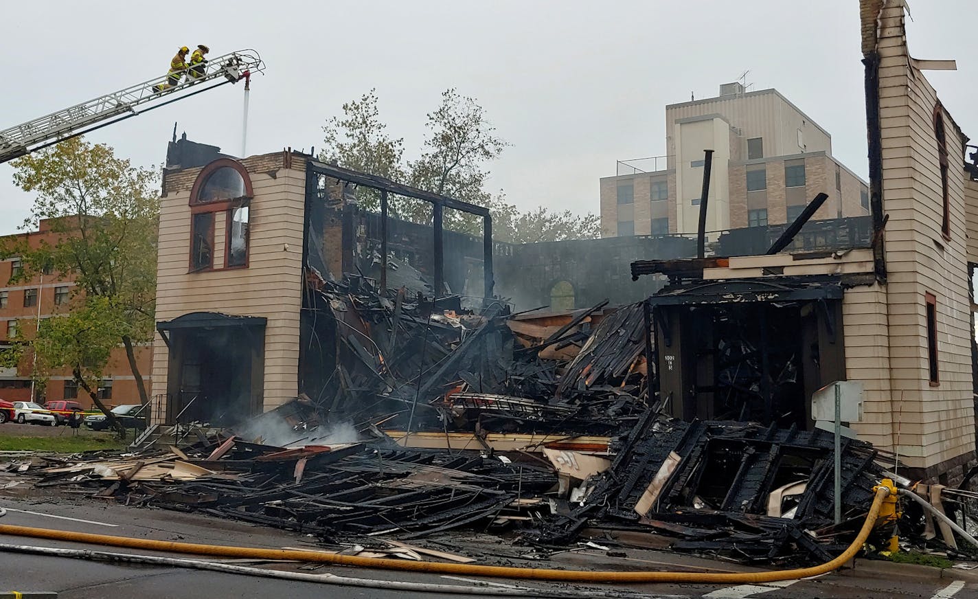 Firefighters work the scene of an overnight fire that engulfed and destroyed a synagogue in downtown Duluth, Minn., Monday, Sept. 9, 2019.