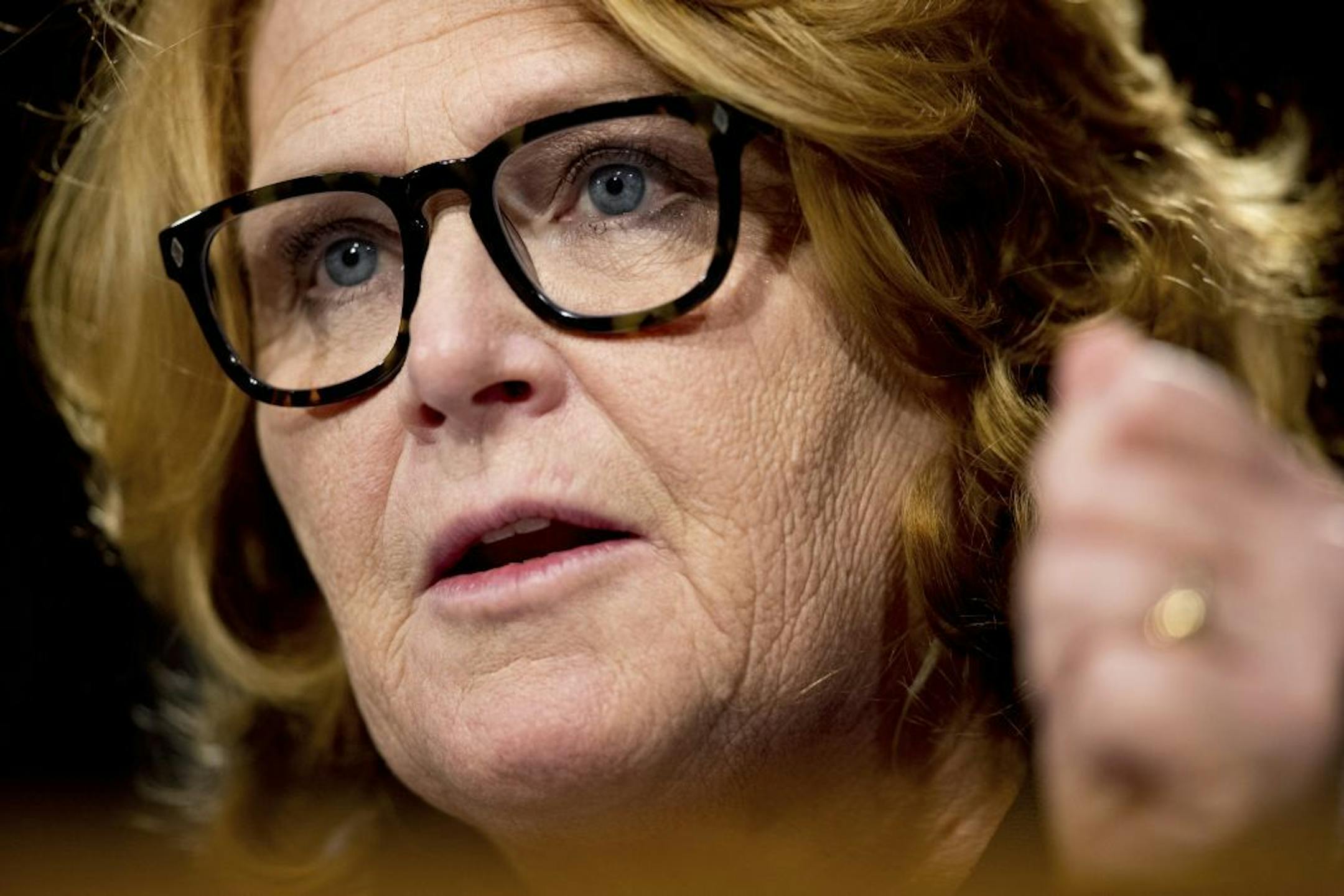 "Either do it or shut," Sen. Heidi Heitkamp, D-N.D., said about tax reform Tuesday at a conference hosted by the Federal Reserve Bank of Minneapolis. "Uncertainty has delayed investment." Above, Heitkamp at a Senate hearing on Feb. 14, 2017.