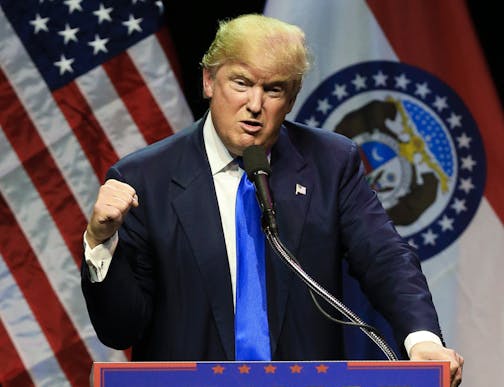 Republican presidential candidate Donald Trump describes how he was ready to punch a person who rushed the stage during an election rally earlier in the day, as he speaks to a crowd in Kansas City, Mo., Saturday, March 12, 2016. (AP Photo/Nati Harnik)
