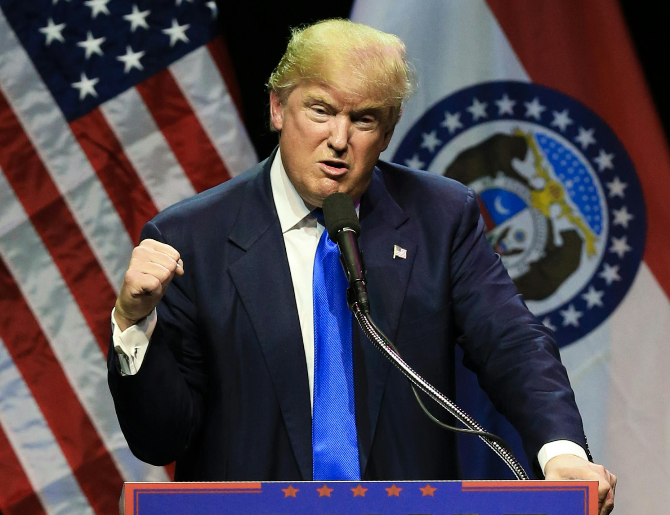 Republican presidential candidate Donald Trump describes how he was ready to punch a person who rushed the stage during an election rally earlier in the day, as he speaks to a crowd in Kansas City, Mo., Saturday, March 12, 2016. (AP Photo/Nati Harnik)