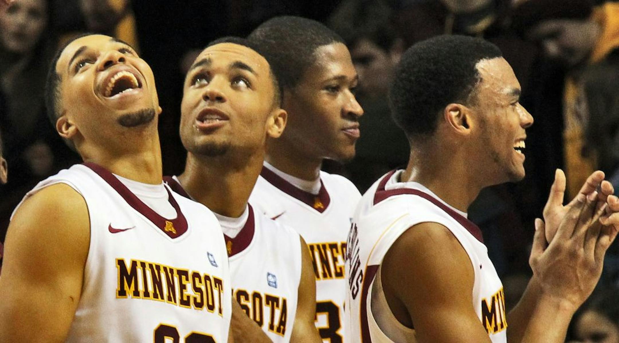 From left, Julian Welch, Joe Coleman, Rodney Williams and Andre Hollins celebrated after defeating Illinois.