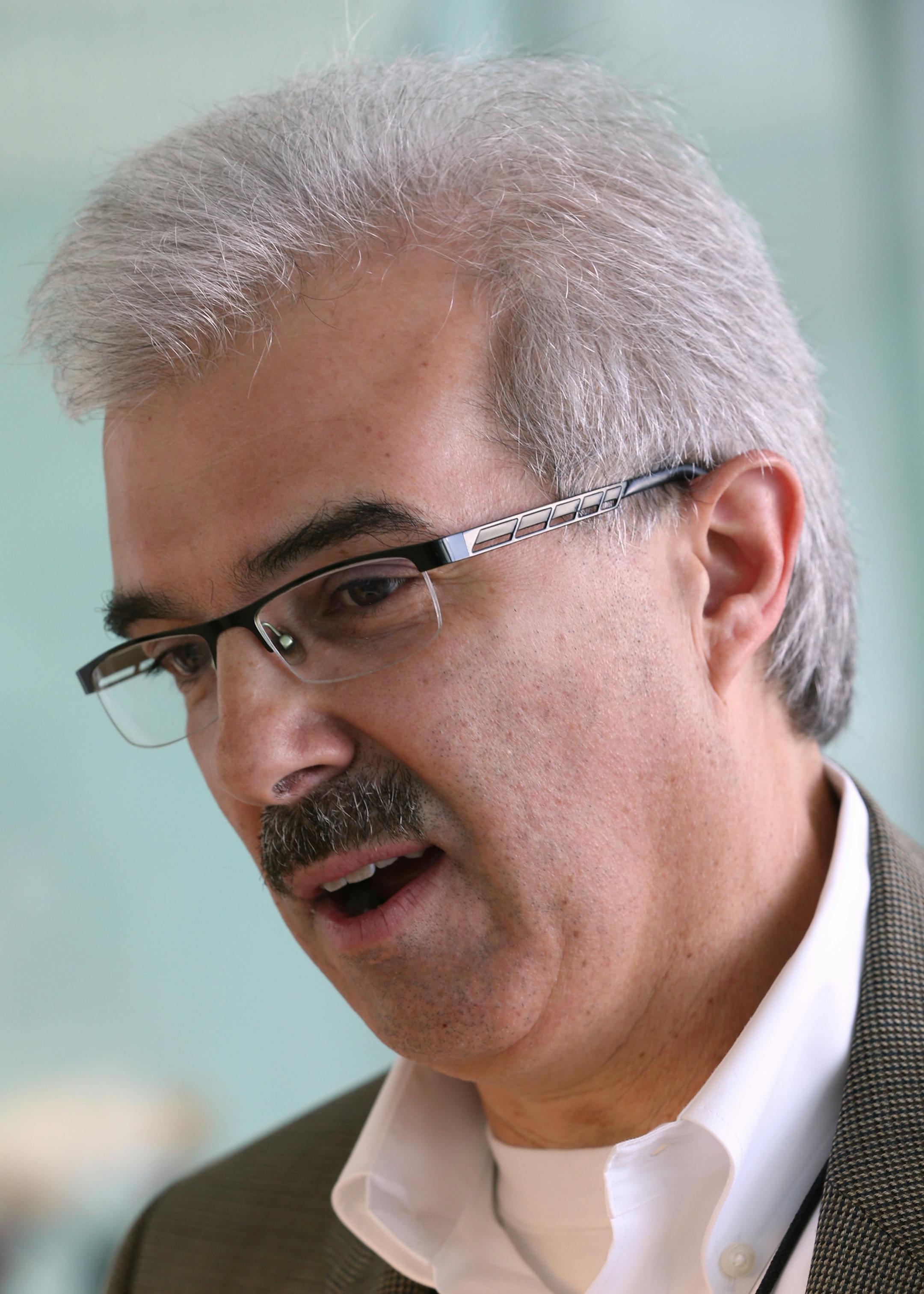 Fred Koerschner, 3M Global Marketing Operations Automotive Division, explained how the 3M wheel weights balancing tape is used on the wheels of Tesla's and other car makes. 3M employees looked at the Tesla S electric car as part of the 3M celebration of Earth Day with displays of other sustainable 3M products including Novec Enginered Fluids, LED lighting and 3M window films, on 4/22/14 at 3M headquarters in Maplewood. 3M also received an award from the EPA for its work in energy efficiency.] Br