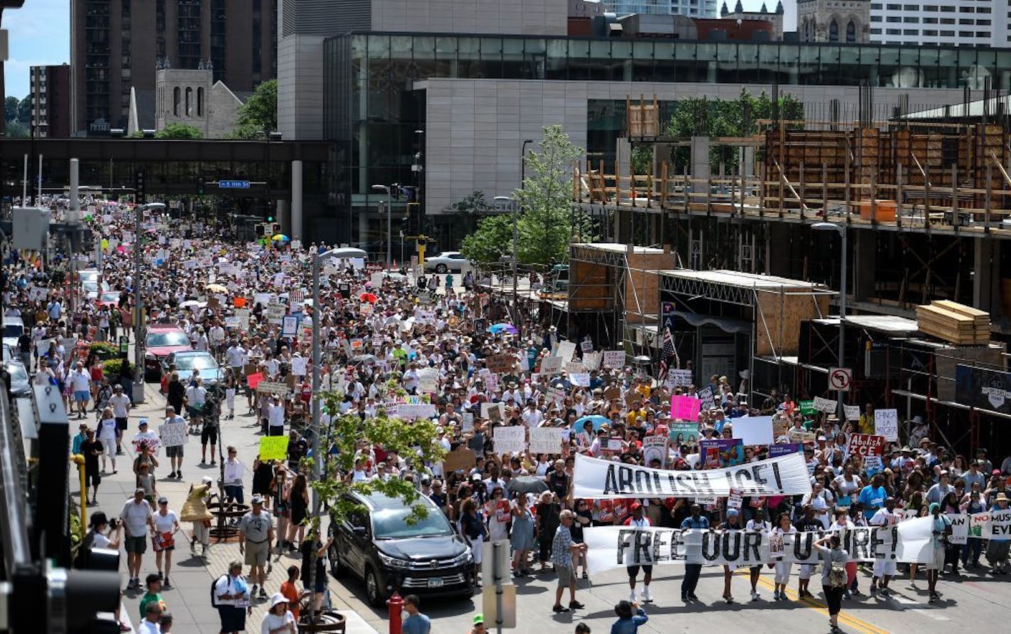 Thousands marched through downtown Minneapolis Saturday afternoon to demonstrate agains the Trump administration's immigration policies.