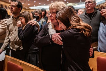 Members of Temple Israel Pam Margolis and granddaughter Josie LaMere join in solidarity in light of the attacks in Israel at Beth El Synagogue in St. 