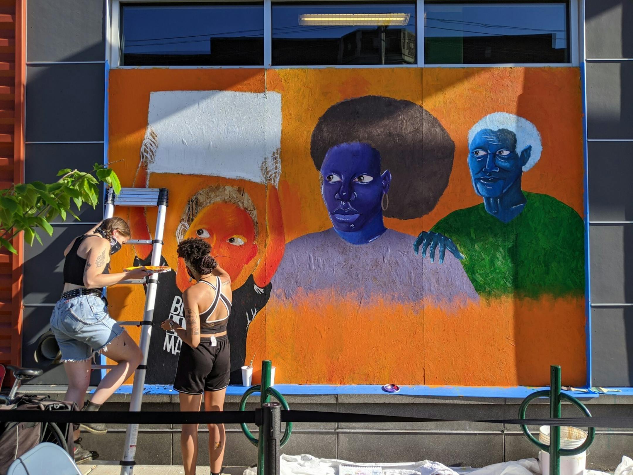 Mural designer Maiya Lea oversaw the design of a mural at Seward Co-op (317 E. 38th St.) depicting intergenerational family members in solidarity following the killing of George Floyd by Minneapolis police.