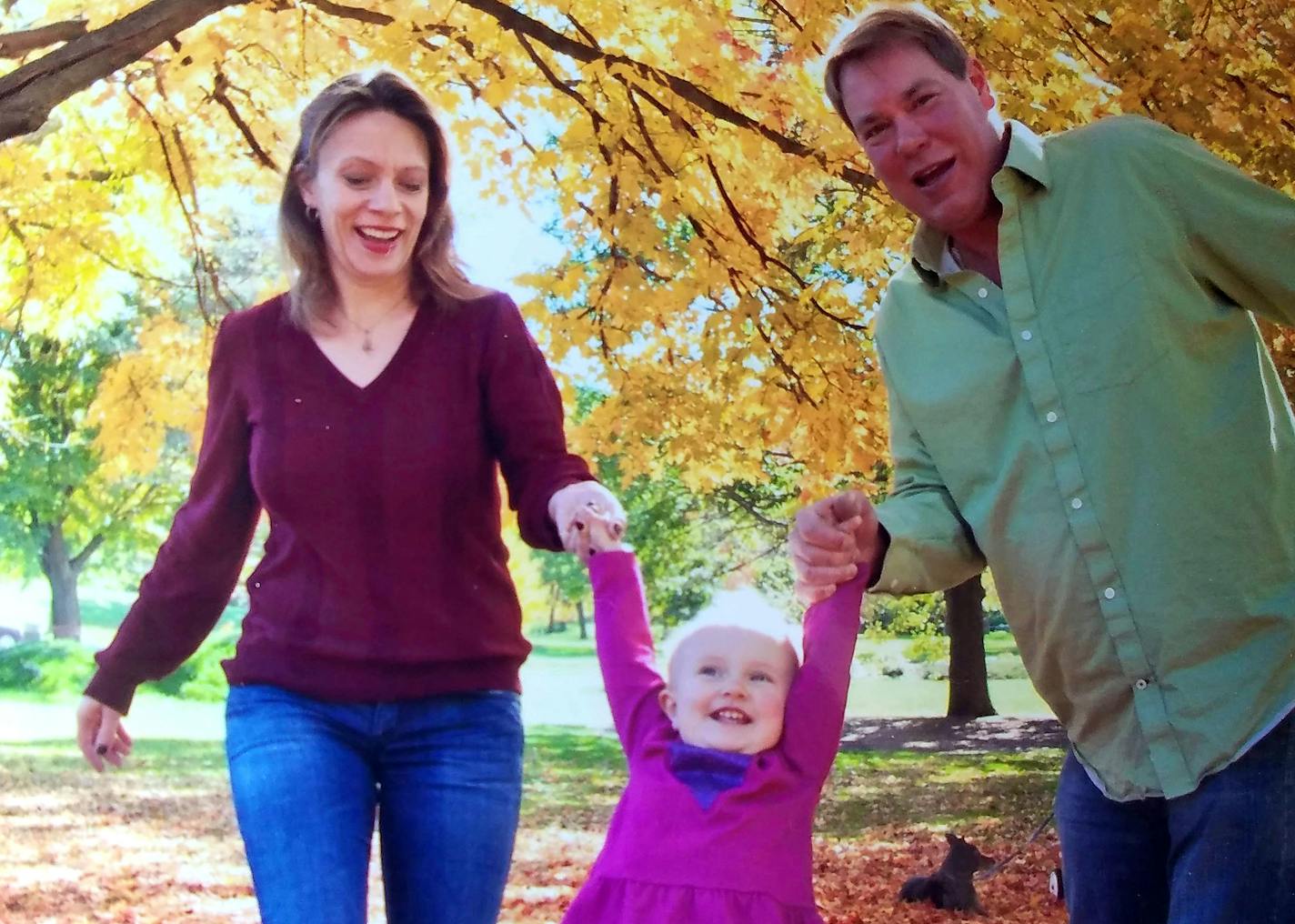 Parents Melina Miller and Jeff Parker, with their daughter, Josi.