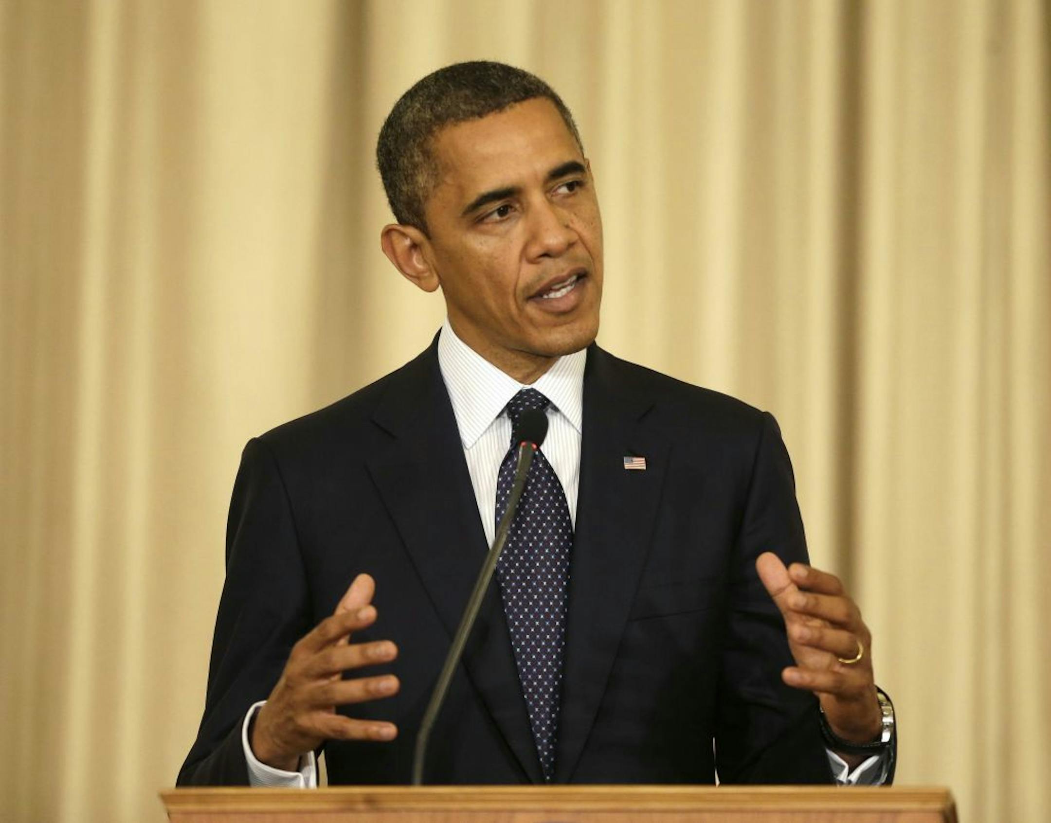 U.S. President Barack Obama gestures during a joint news conference with Thai Prime Minister Yingluck Shinawatra at Thai Government House in Bangkok, Thailand, Sunday, Nov. 18, 2012.