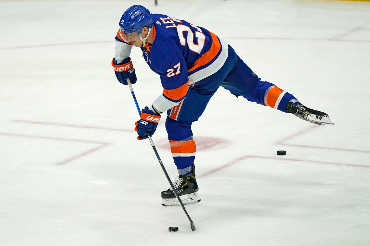 New York Islanders center Anders Lee (27) takes a shot during pregame warmups before an NHL hockey game against the Pittsburgh Penguins, Thursday, Feb. 11, 2021, in Uniondale, N.Y. (AP Photo/Kathy Willens)