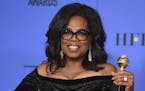 In this Jan. 7, 2018, file photo, Oprah Winfrey poses in the press room with the Cecil B. DeMille Award at the 75th annual Golden Globe Awards in Beve