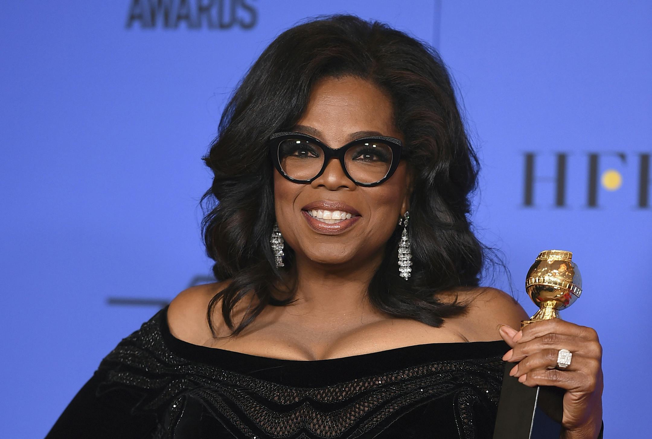 In this Jan. 7, 2018, file photo, Oprah Winfrey poses in the press room with the Cecil B. DeMille Award at the 75th annual Golden Globe Awards in Beverly Hills, Calif. Winfrey has visited the grave of a black Alabama woman whose rape by six white men in 1944 drew national attention and whose story was highlighted in Winfrey's recent Golden Globes speech. Winfrey said in an Instagram post that on assignment for "60 Minutes," she ended up in the town of Abbeville, Ala., where Recy Taylor suffered