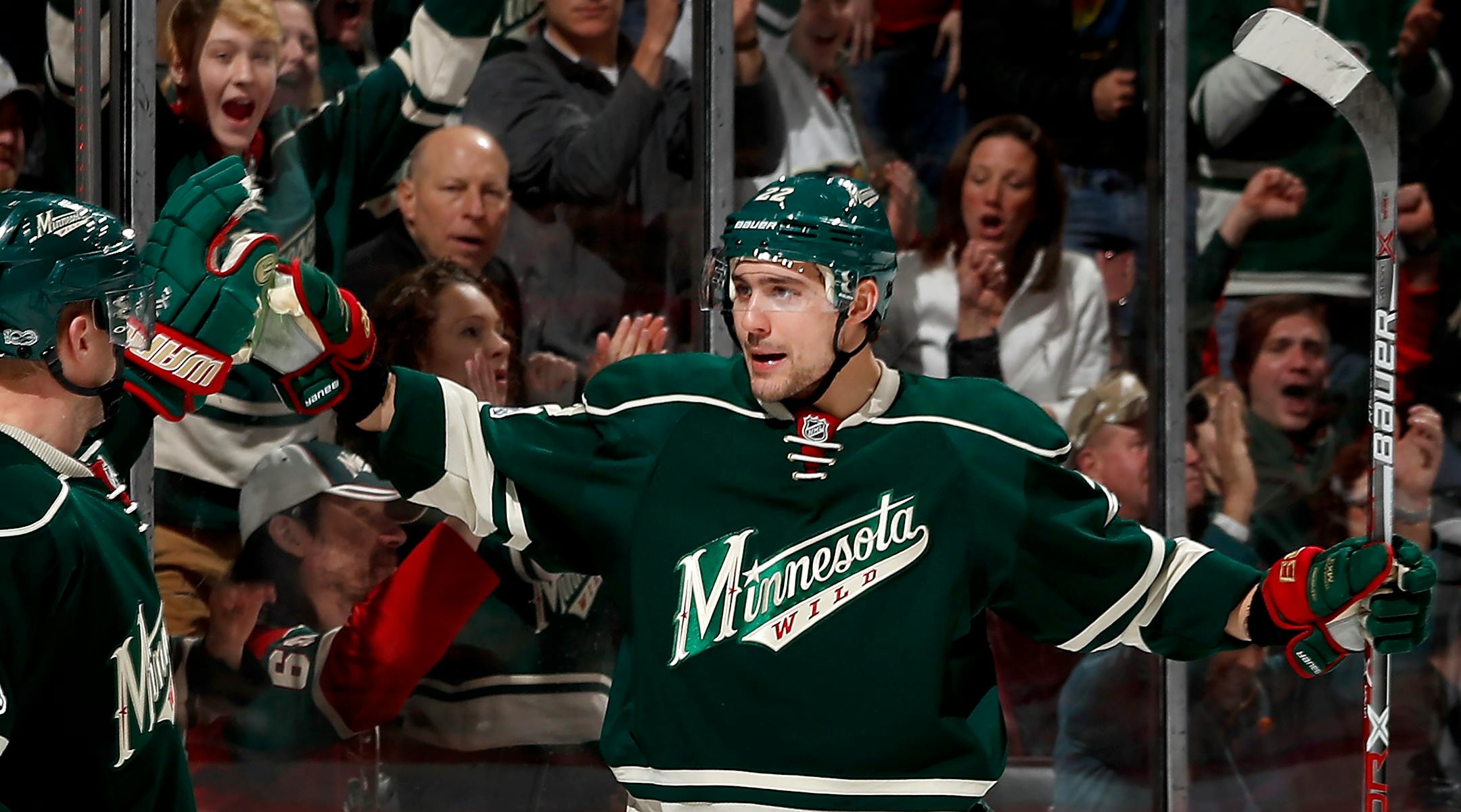 Mikko Koivu (9) and Nino Niederreiter (22) celebrated a power play goal by Niederreiter in the first period.