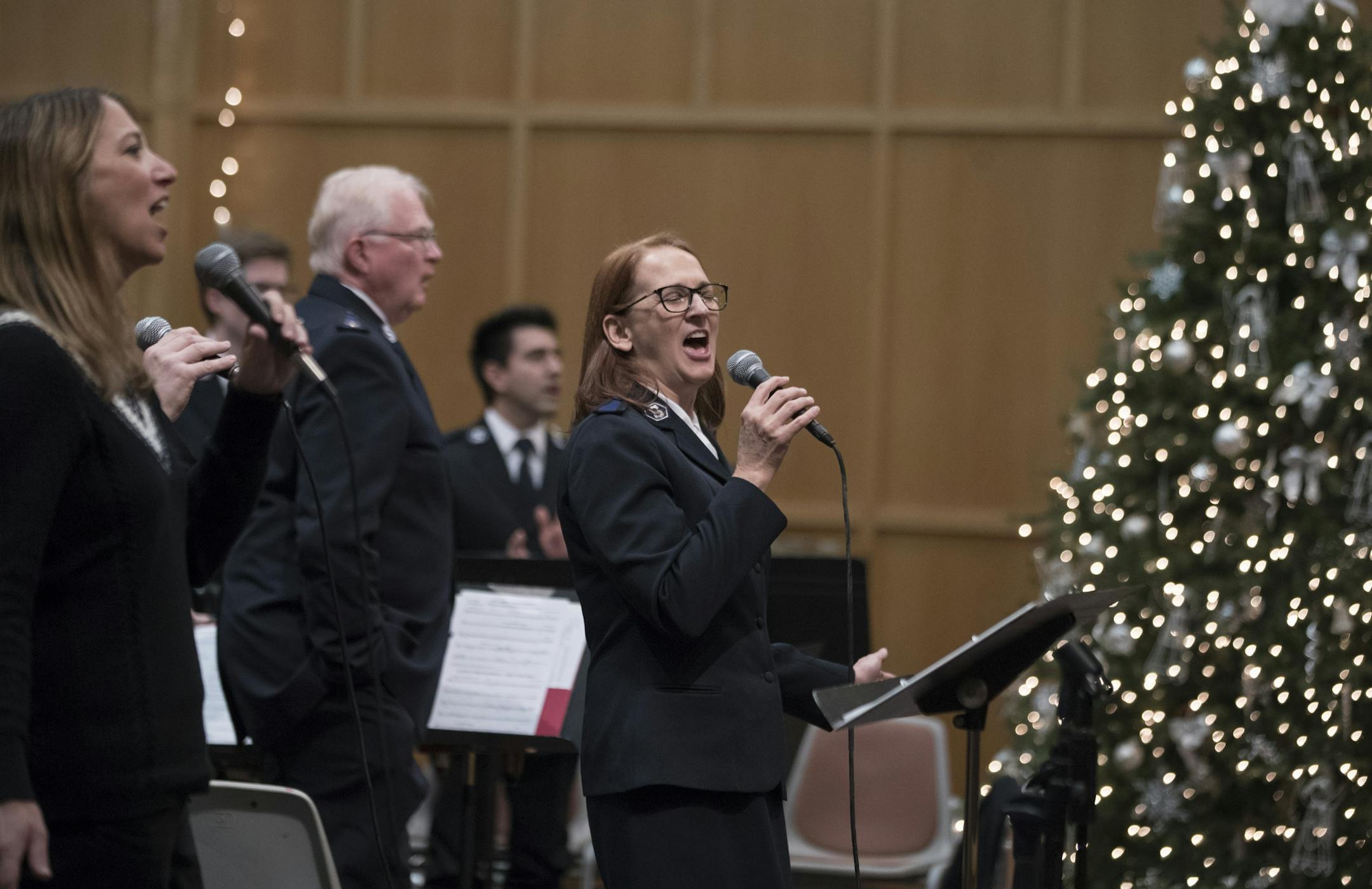 Marian Henry right lead a song by members of the church during worship services at the Salvation Army Center Sunday December 10, 2017 in Maplewood MN.