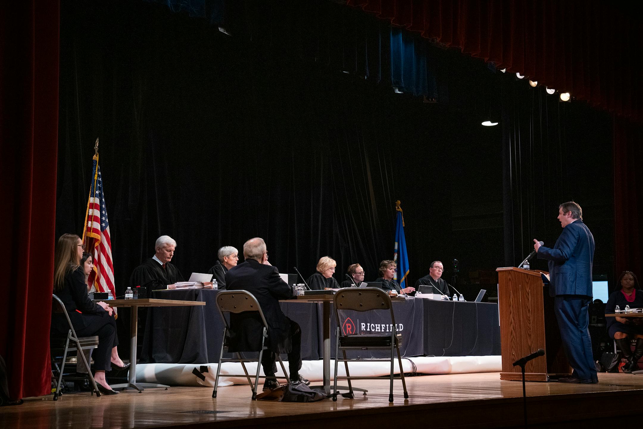 Attorney Richard Landon argues for the appellant before the Minnesota Supreme Court in the case of Cruz-Guzman v. State of Minnesota inside the auditorium at Richfield High School.