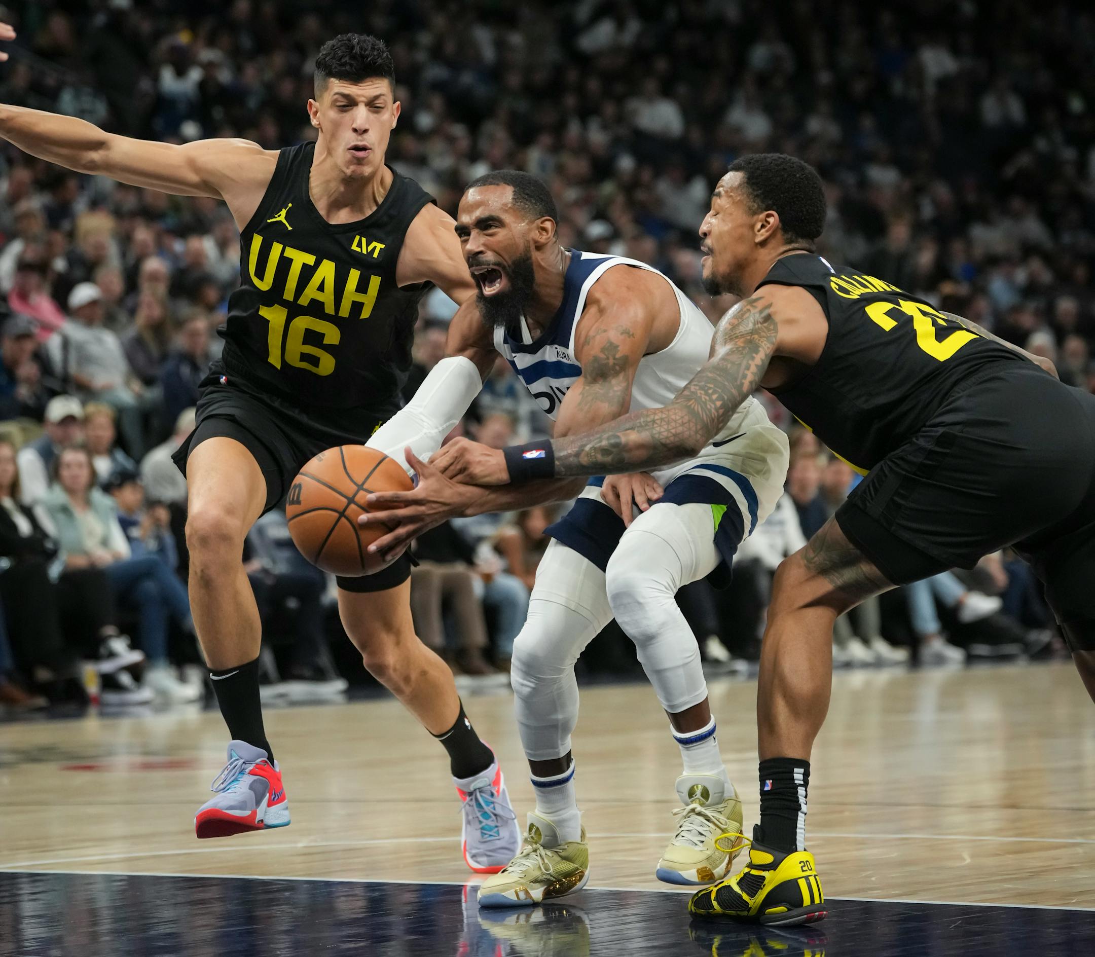 Minnesota Timberwolves guard Mike Conley (10) reacts to a foul by Utah Jazz forward John Collins (20) in the second half. The Minnesota Timberwolves defeated the Utah Jazz 101-90 at Target Center on Thursday, Nov. 30, 2023 in Minneapolis, Minn. ] RENEE JONES SCHNEIDER • renee.jones@startribune.com