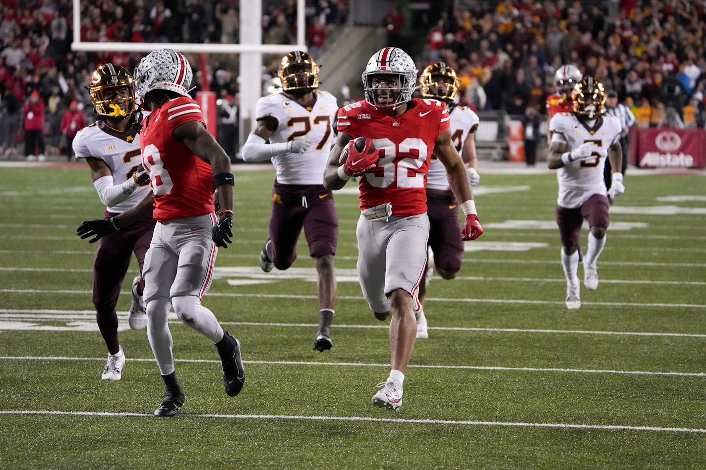 Running back TreVeyon Henderson (32) of the Ohio State Buckeyes carries the ball during the third quarter against the Minnesota Golden Gophersat Ohio Stadium on Nov. 18, 2023, in Columbus, Ohio. (Jason Mowry/Getty Images/TNS) ORG XMIT: 95669184W