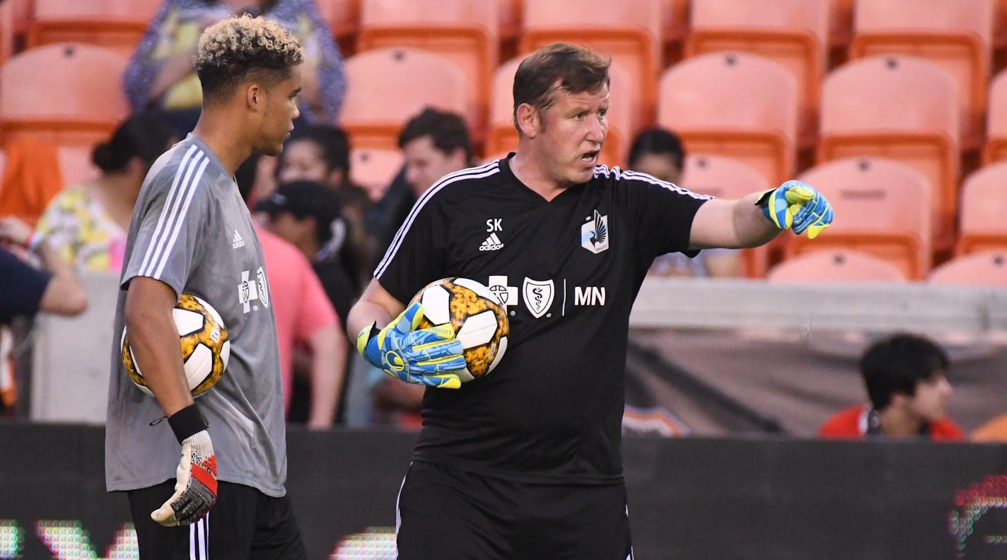 New Minnesota goalkeeper coach Stewart Kerr, right, works with backup rookie goalkeeper Dayne St. Clair on the field Wednesday at Houston.