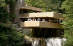 FILE - This Aug. 23, 2007, file photo, visitors gather on one of the cantilevered terraces at Fallingwater, a Frank Lloyd Wright design in Bear Run, P