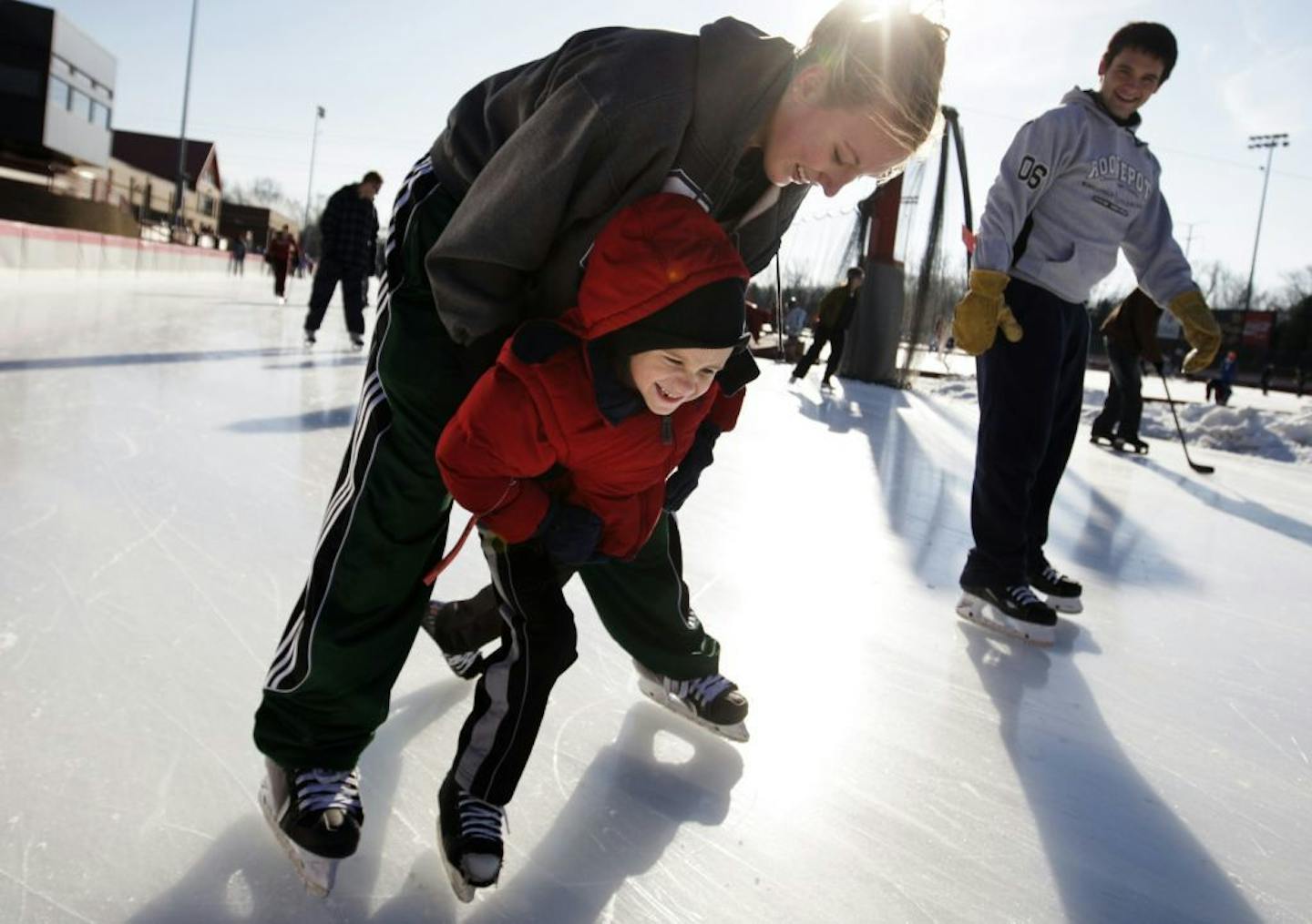 Richard Tsong-Taatarii/rtsong-taatarii@startribune.com Roseville, MN;11/25/07;left to right: At the Roseville Oval Skating Rink, Lukas Hintzman,5, was learning to skate from his aunt Jackie Brigl. Brigl plays hockey for Roseville High School. The rink was open to the public from 1:30 to 3:30 in the afternoon. Outdoor ice skating will be available through March.