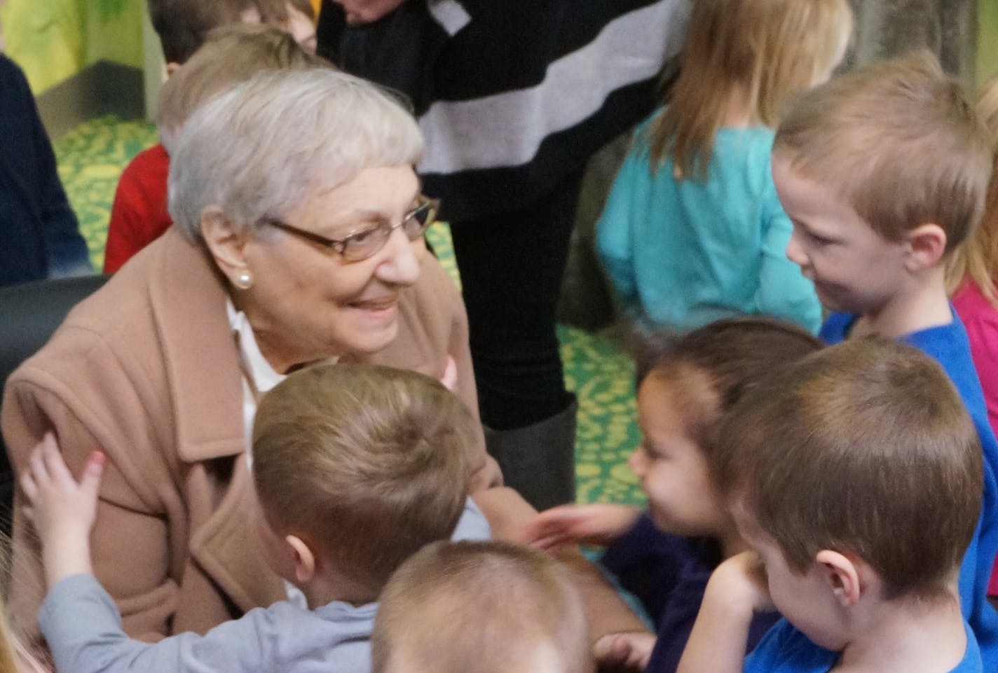 On a weekday morning, 80-year old Dora McLellan is sitting amidst a group of toddlers, being besieged by hugs. McLellan has just finished reading a book to the children. But it&#x201a;&#xc4;&#xf4;s not just any book. It&#x201a;&#xc4;&#xf4;s &#x201a;&#xc4;&#xfa;Stevie Star,&#x201a;&#xc4;&#xf9; a book McLellan herself wrote more than 50 years ago. Photo by Dylan Peers McCoy, Special to the Star Tribune