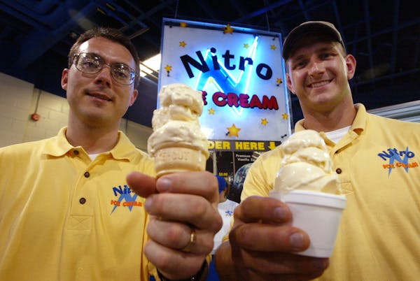 St. Paul, MN 8/26/2002 Nitro Ice Cream. T.J. Paskach and Will Schroeder at the Minnesota State Fair Food building.