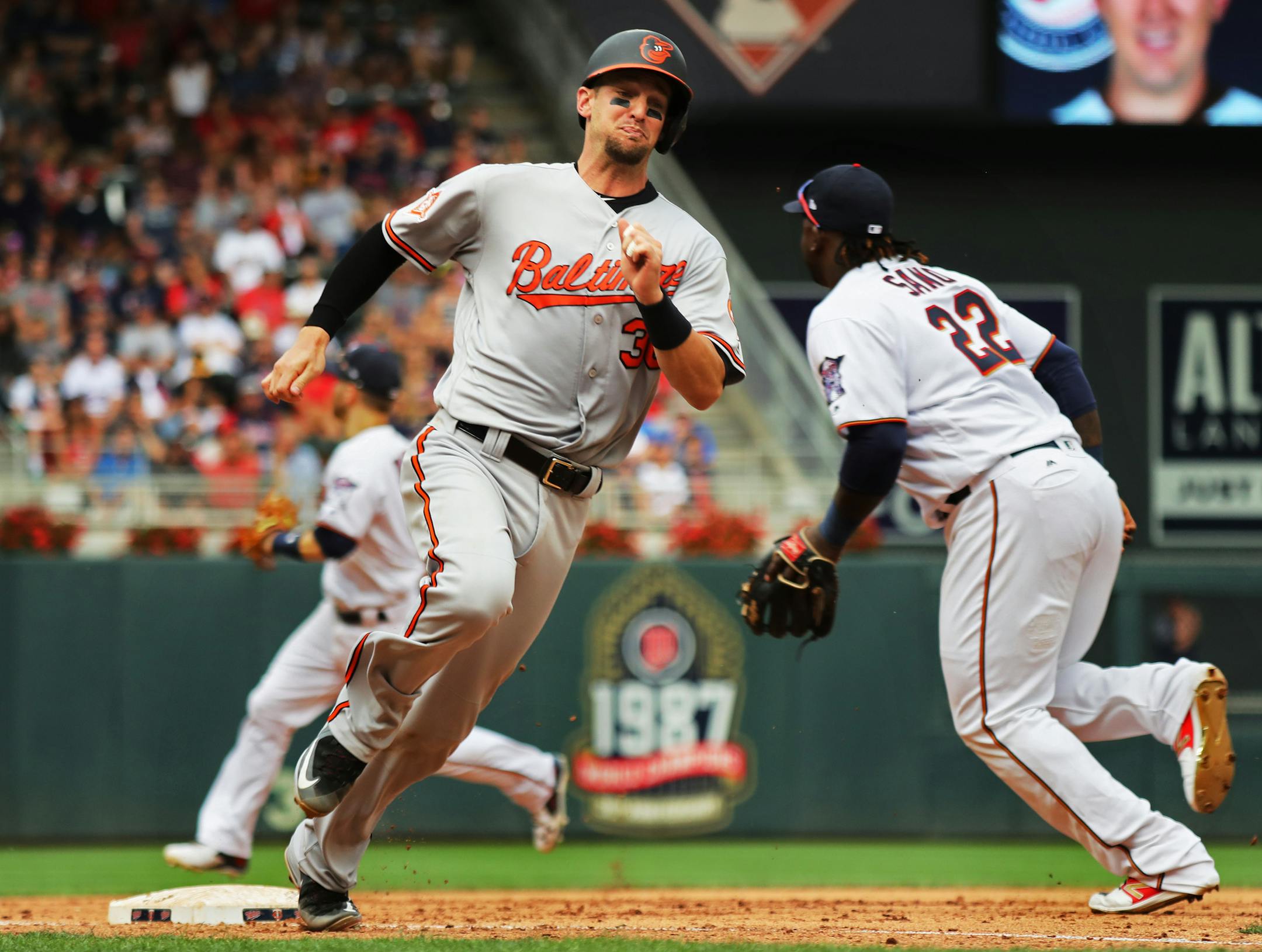The Orioles' Caleb Joseph raced around third to score on a double by Ruben Tejada in the fifth inning in an 11-5 victory over the Twins at Target Field on Sunday.