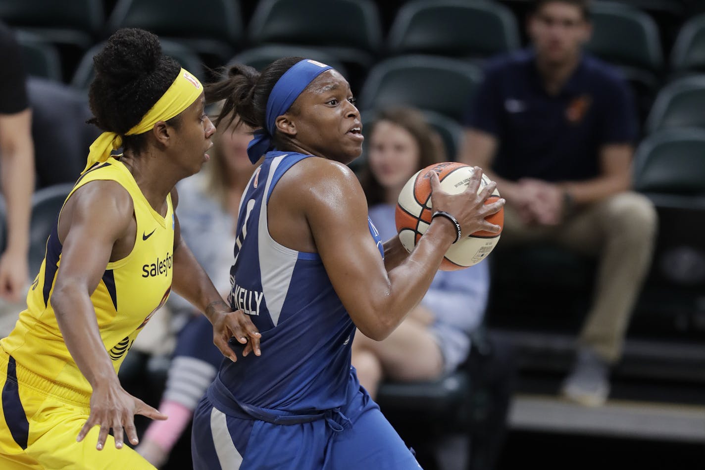 Minnesota Lynx's Karima Christmas-Kelly (0) drives to the basket against Indiana Fever's Shenise Johnson during the first half of a WNBA basketball game, Tuesday, June 25, 2019, in Indianapolis. (AP Photo/Darron Cummings)