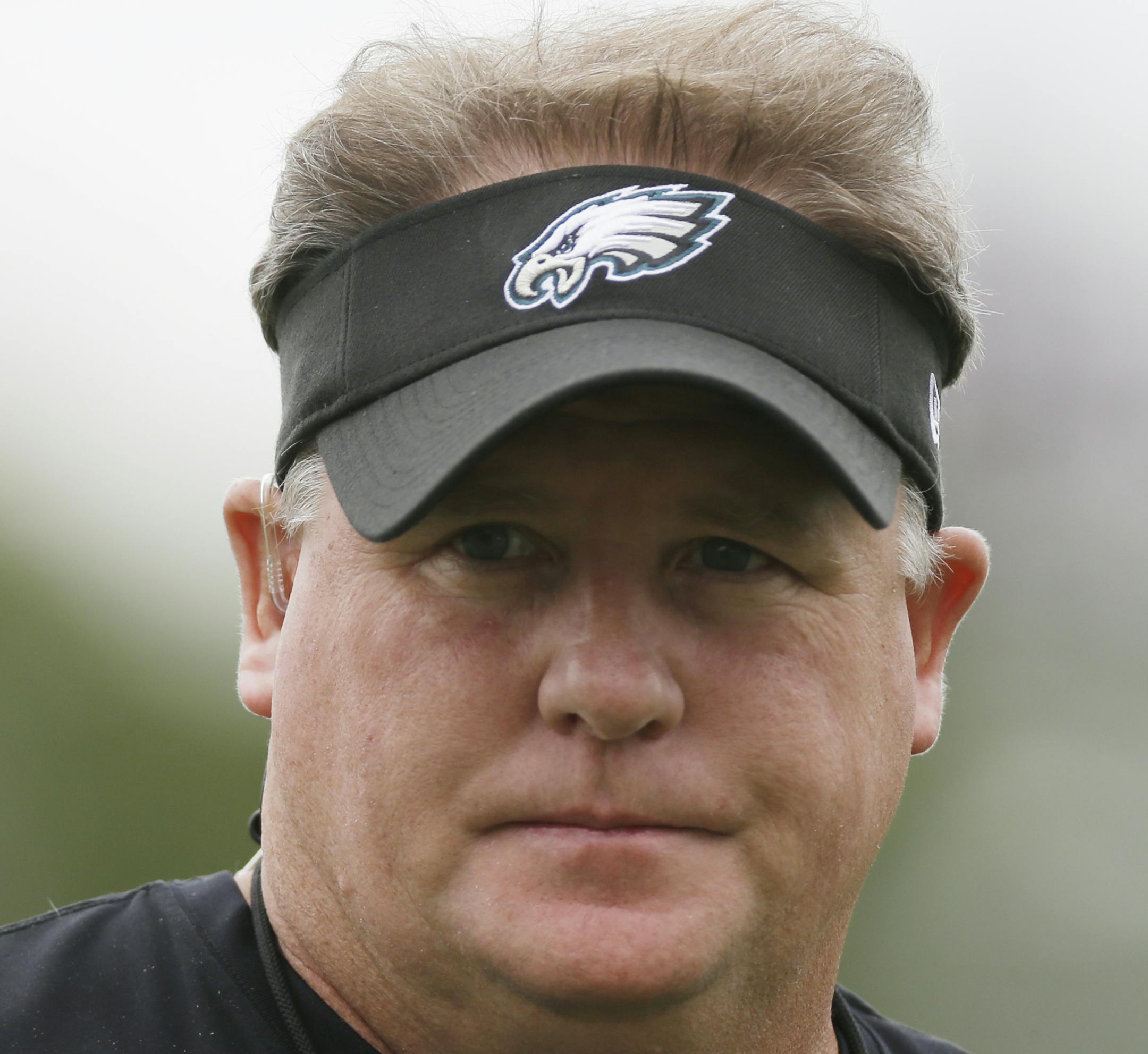 Philadelphia Eagles head coach Chip Kelly walks on the field at a joint workout with the New England Patriots during NFL football training camp in Philadelphia, Wednesday, Aug. 7, 2013. (AP Photo/Matt Rourke) ORG XMIT: OTKMR
