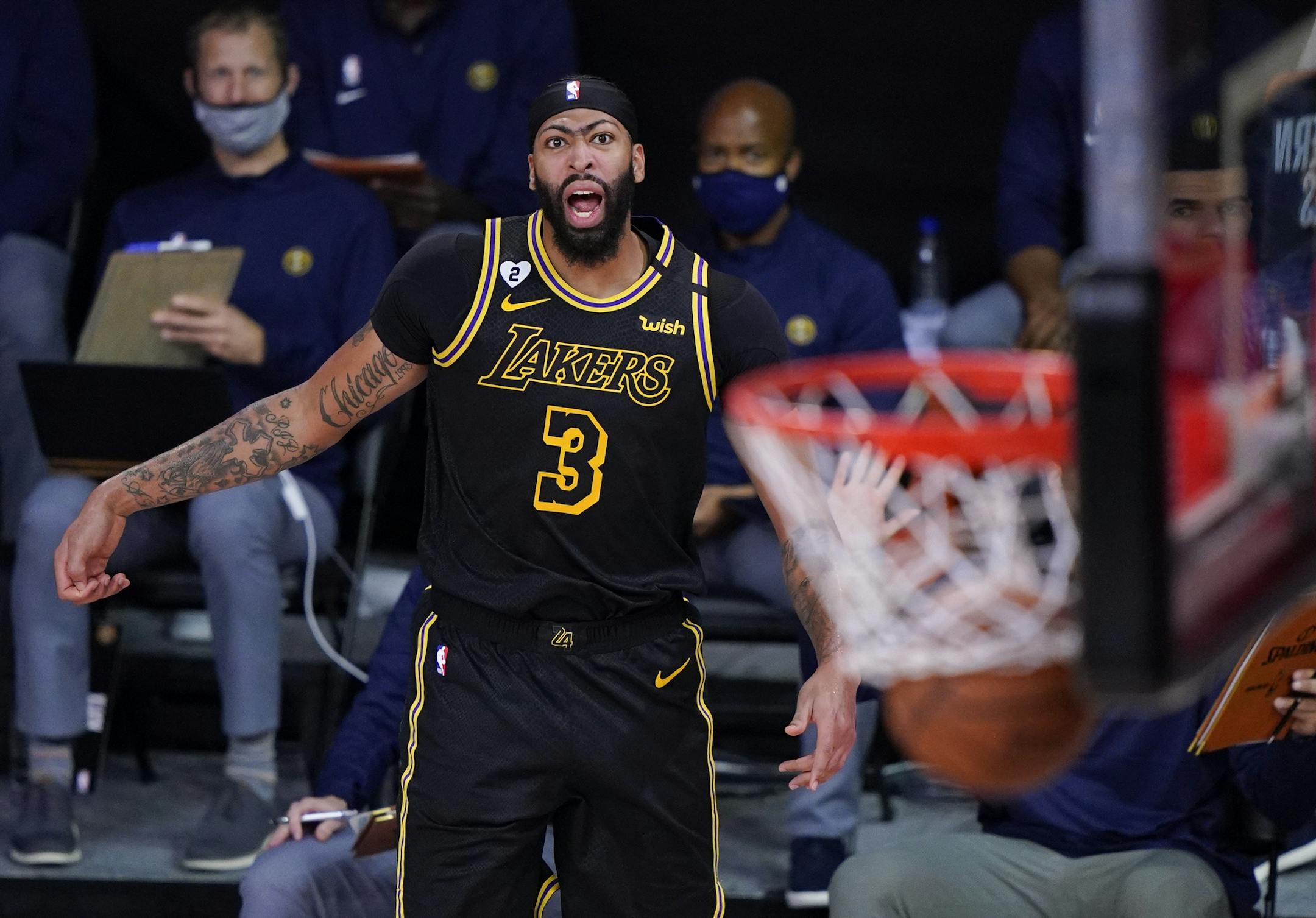 Los Angeles Lakers' Anthony Davis (3) reacts after making a 3-point basket during the second half of an NBA conference final playoff basketball game against the Denver Nuggets Sunday, Sept. 20, 2020, in Lake Buena Vista, Fla. (AP Photo/Mark J. Terrill)