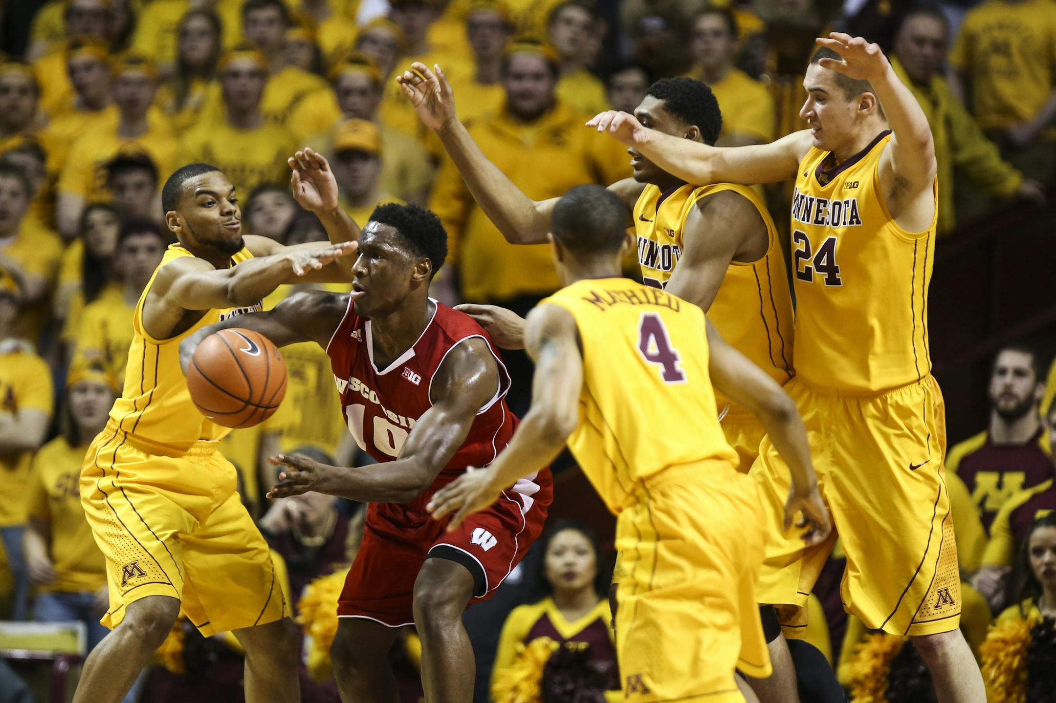 Minnesota's Andre Hollins (1) Charles Buggs (23) and Joey King (24) tried to stop Wisconsin's Nigel Hayes from passing during the second half. ] RENEE JONES SCHNEIDER • reneejones@startribune.com The Minnesota Gophers played the Wisconsin Badgers at Williams Arena on Thursday, March 5, 2015 at the University of Minnesota in Minneapolis, Minn.