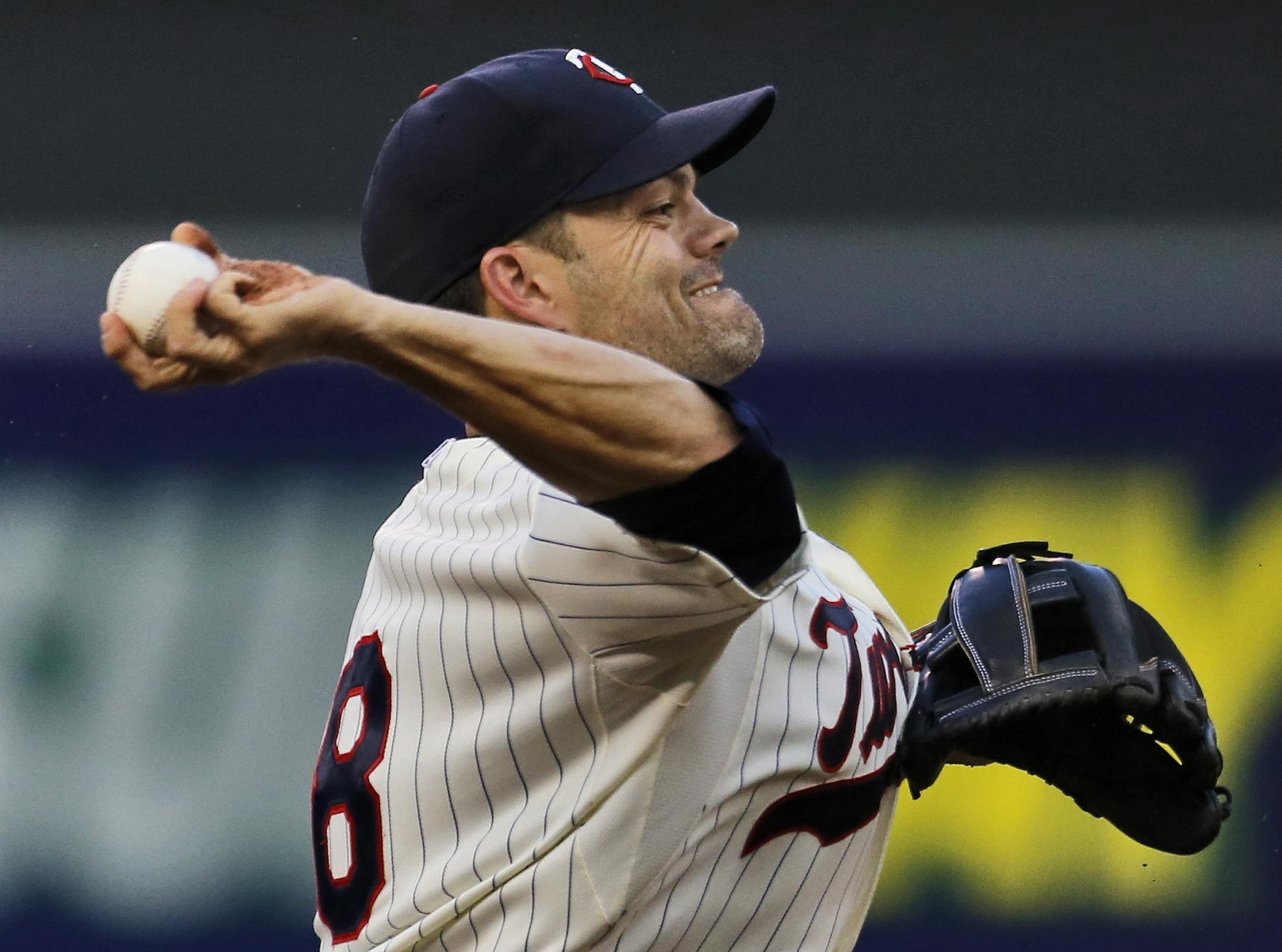 Minnesota Twins vs. Philadelphia Phillies. Twins third baseman jamey Carroll made a quick throw to first base in an attempt to throw out Phillies Ben Revere in first inning action. (MARLIN LEVISON/STARTRIBUNE(mlevison@startribune.com