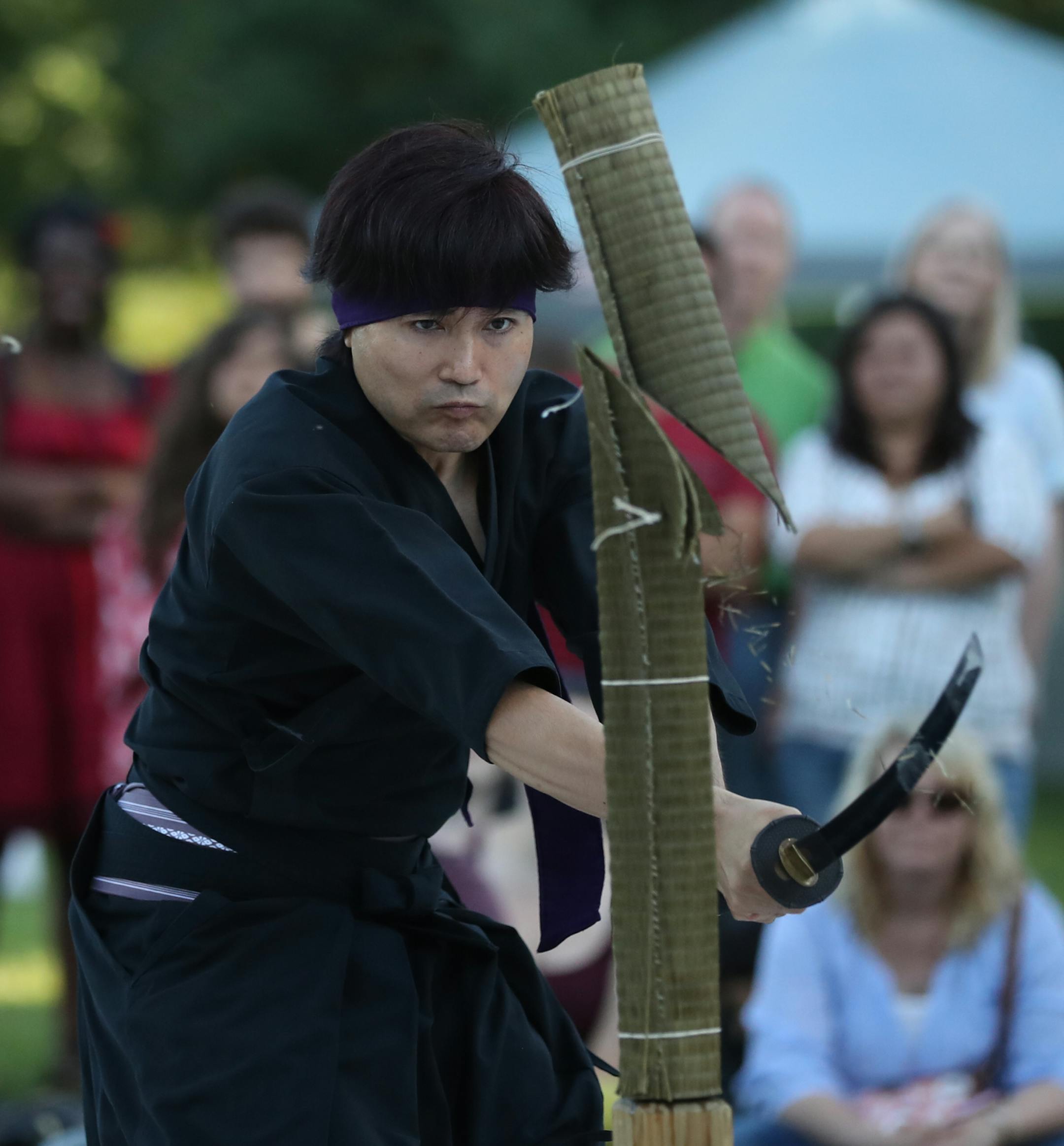 Hiro Kato sliced through a rolled bamboo mat as he demonstrated kenjutsu or Japanese swordsmanship. He is with the Kaishin Dojo of West St. Paul. ] JEFF WHEELER ï jeff.wheeler@startribune.com The Como Park Conservatory's 18th annual Japanese Lantern Lighting Festival took place Sunday evening, August 21, 2016. Thousands gathered around the Frog Pond beside the Marjorie McNeely Conservatory in Como Park to watch as lanterns were floated on the water at dusk. The event is reminiscent of Japan
