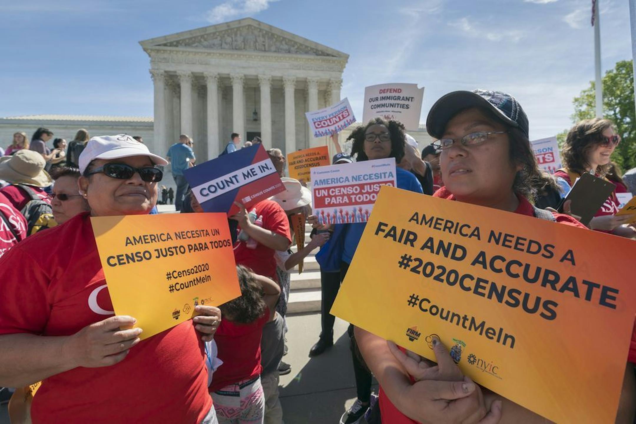 FILE - In this April 23, 2019 file photo, immigration activists rally outside the Supreme Court as the justices hear arguments over the Trump administration's plan to ask about citizenship on the 2020 census, in Washington. A new court filing Thursday, May 30 by lawyers opposing adding the citizenship question to the 2020 census alleges a longtime Republican redistricting expert played a key role in making the change.