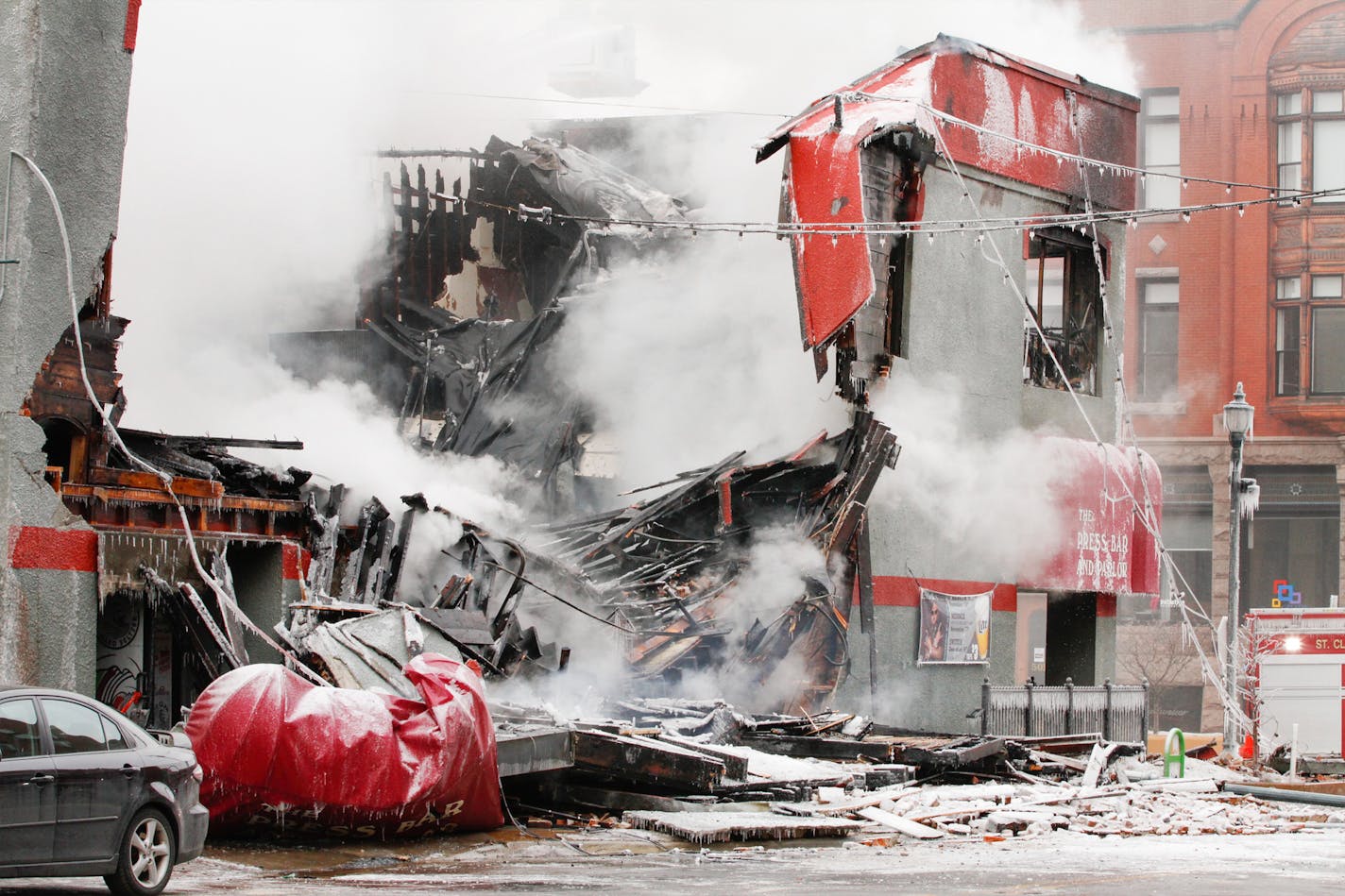 Firefighters from St. Cloud, Sartell and Sauk Rapids battled a major fire in downtown St. Cloud at the Press Bar and Parlor on Feb. 17.